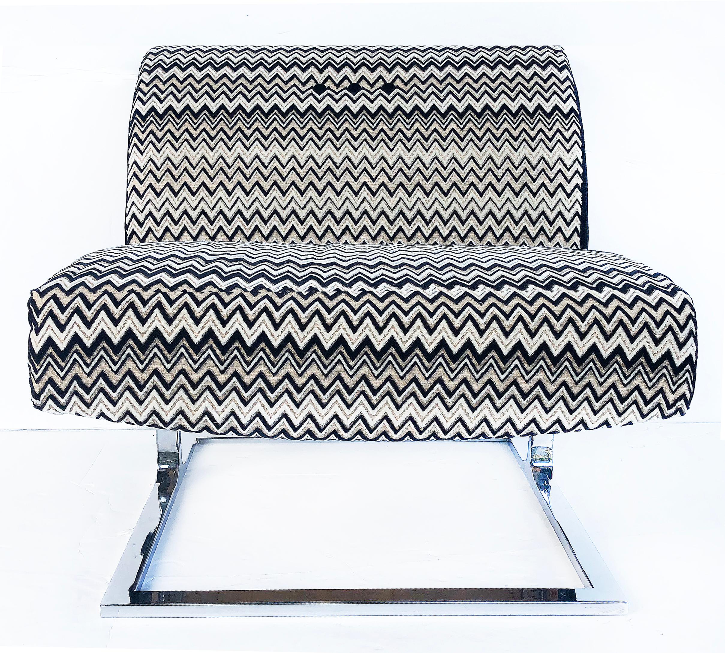 Mid-Century Modern stainless upholstered slipper chairs, pair

Offered for sale is a pair of Mid-Century Modern upholstered slipper chairs with a contrasting combination of a woven chevron pattern and black fabric. Theses substantial chairs are