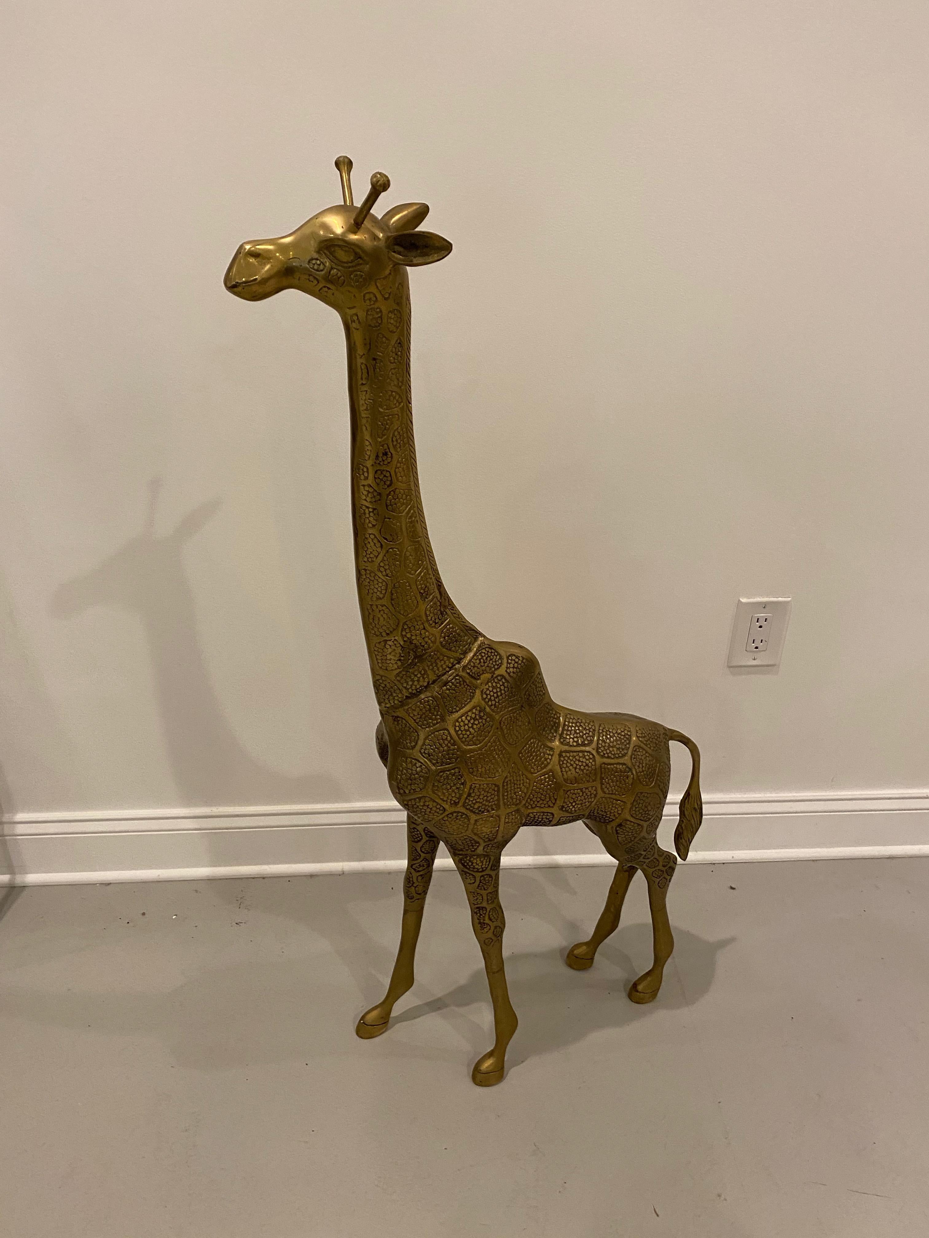 Midcentury standing metal giraffe with beautiful details throughout. Some signs of oxidation. Please look through all images.