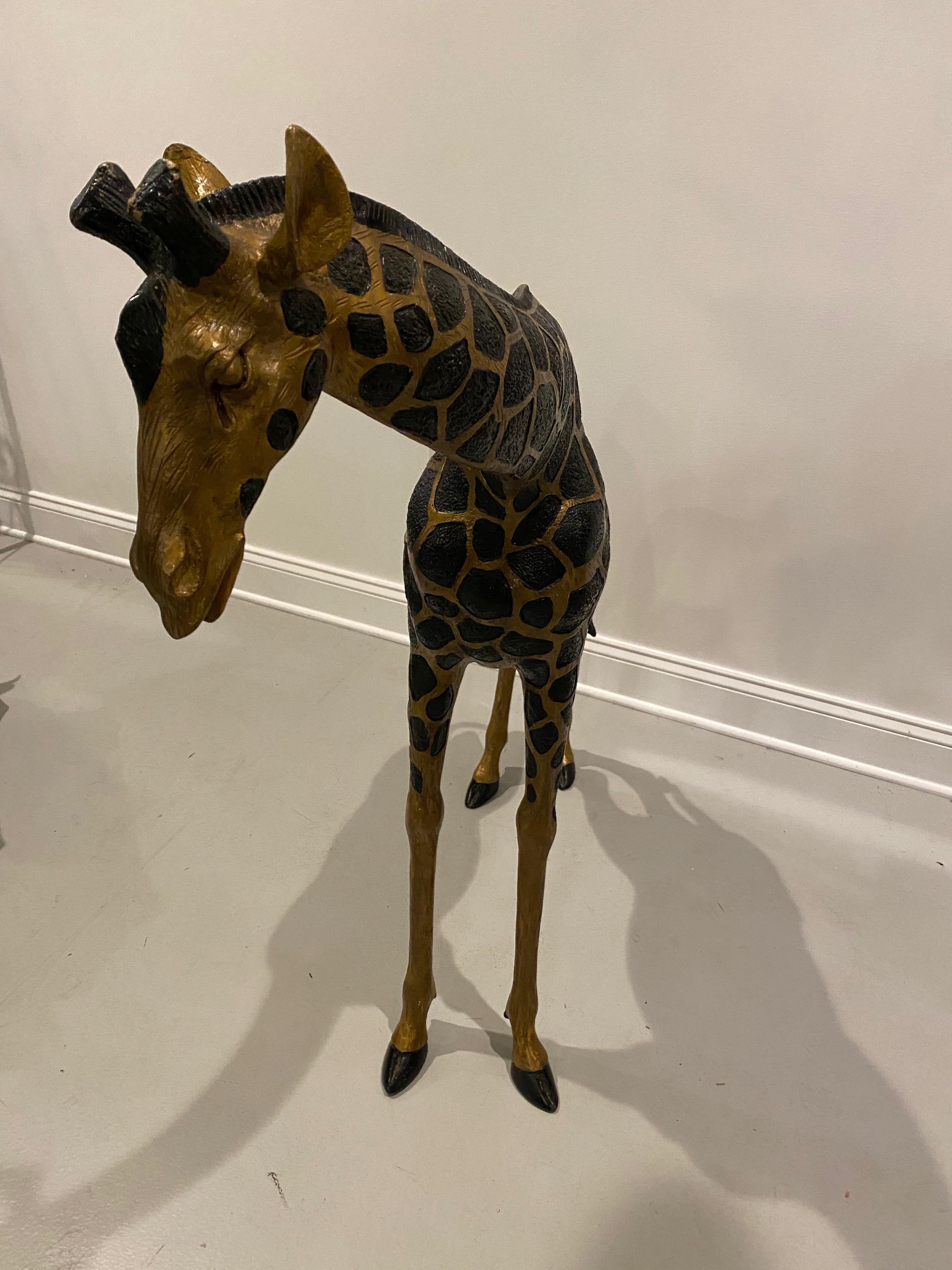 Midcentury standing metal giraffe with beautiful details throughout. Some signs of oxidation. Please look through all images. Measures: 45 inches in height.