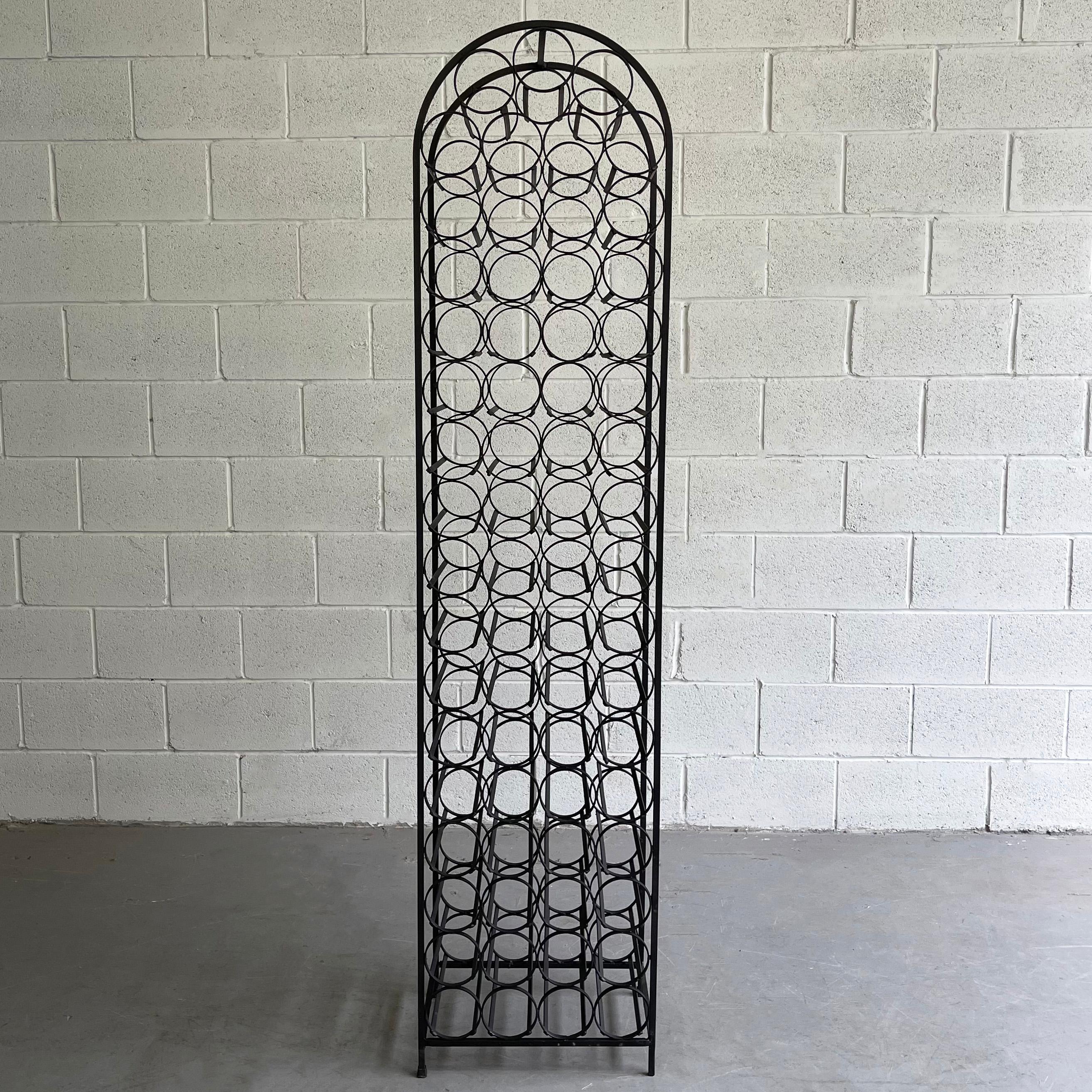 Tall, Mid-Century Modern, free-standing, wrought iron, wine rack by Arthur Umanoff for shaver howard offers stylish wine storage for 67 bottle capacity.