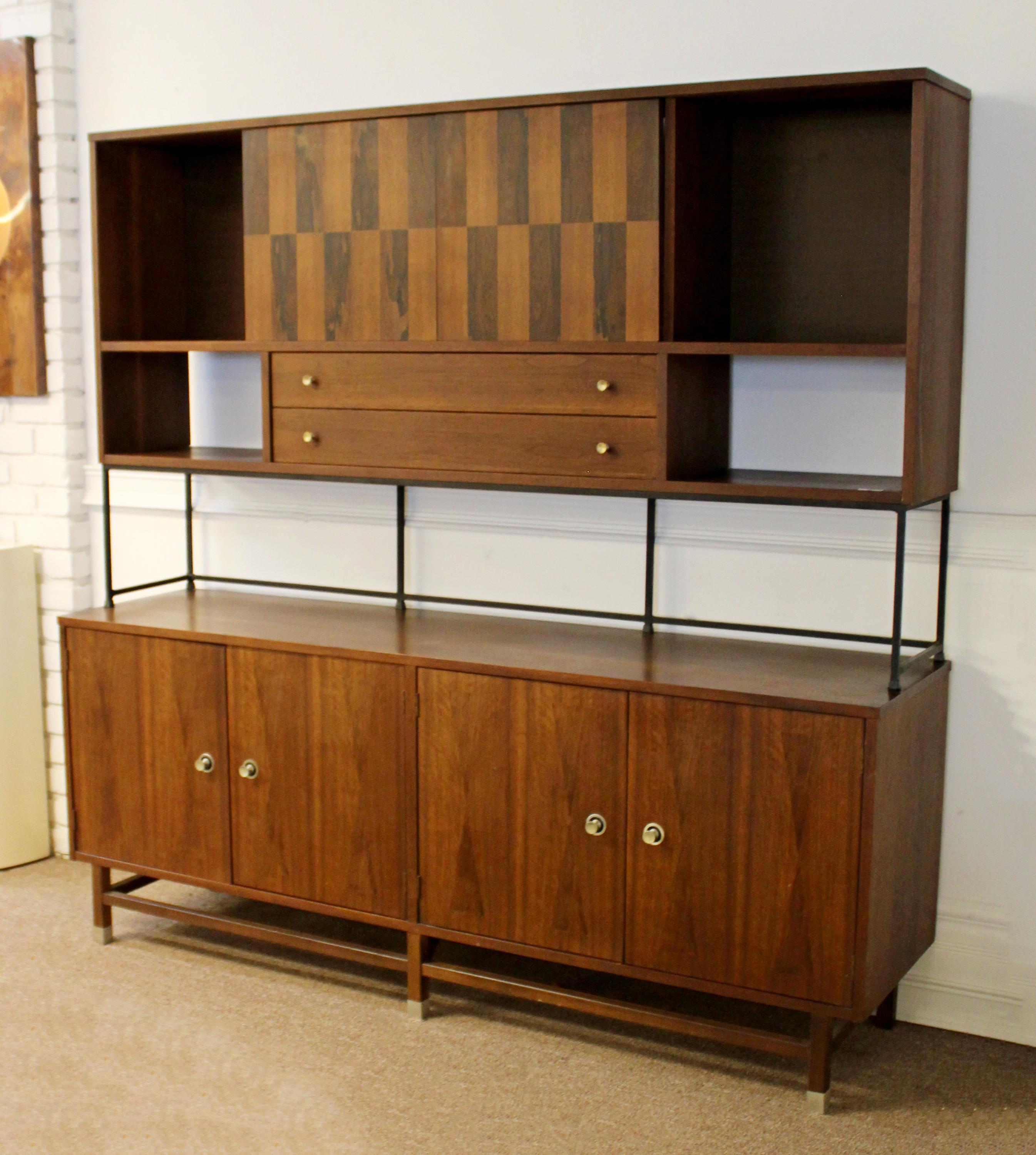 For your consideration is a phenomenal, rosewood and walnut credenza, and a hutch with sliding doors, by Stanley Distinctive Furniture, circa the 1960s. In excellent vintage condition. The dimensions of the credenza are 72