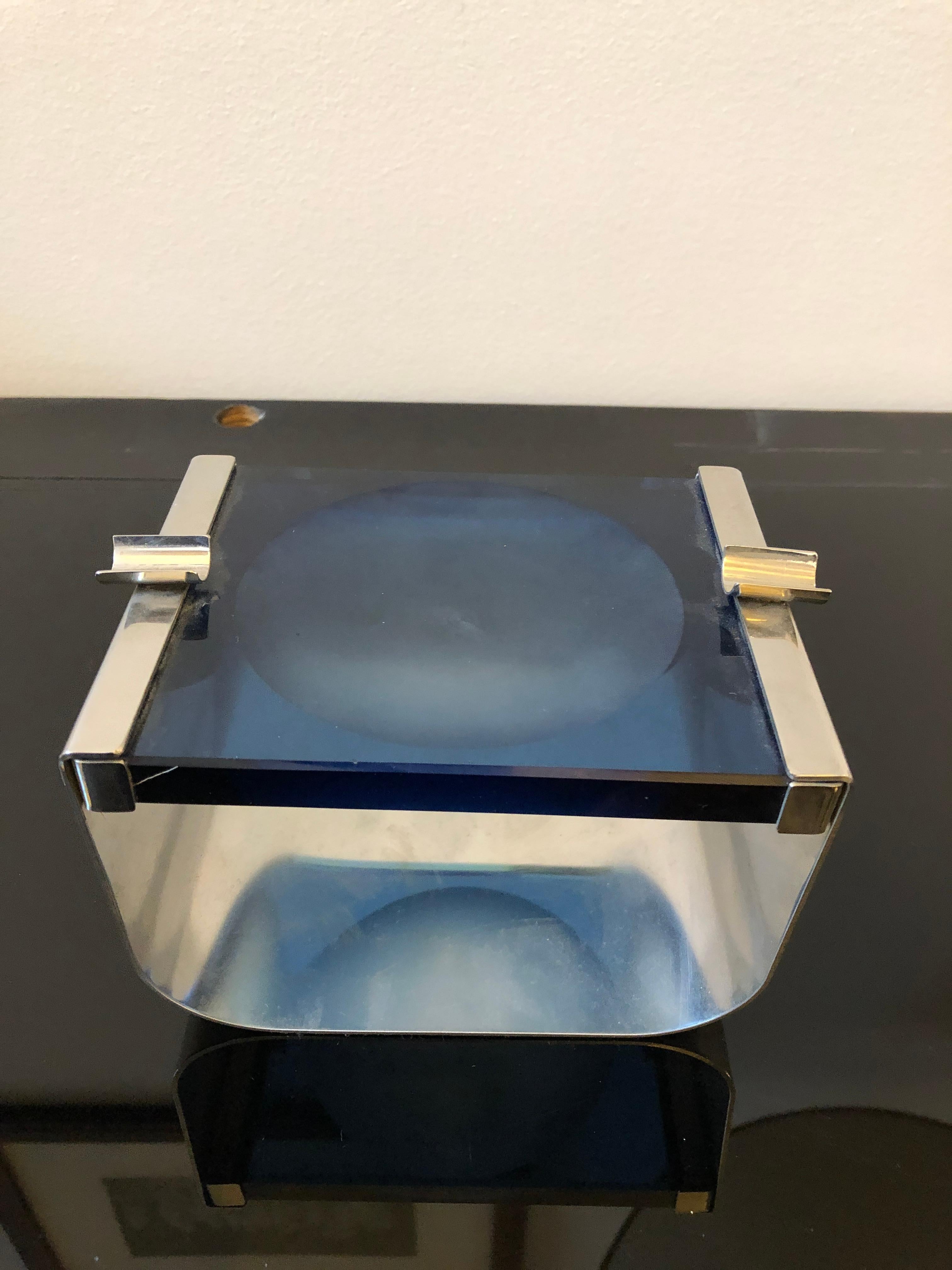 A particular blue glass and steel ashtray made in Italy in the 1970s in perfect conditions.