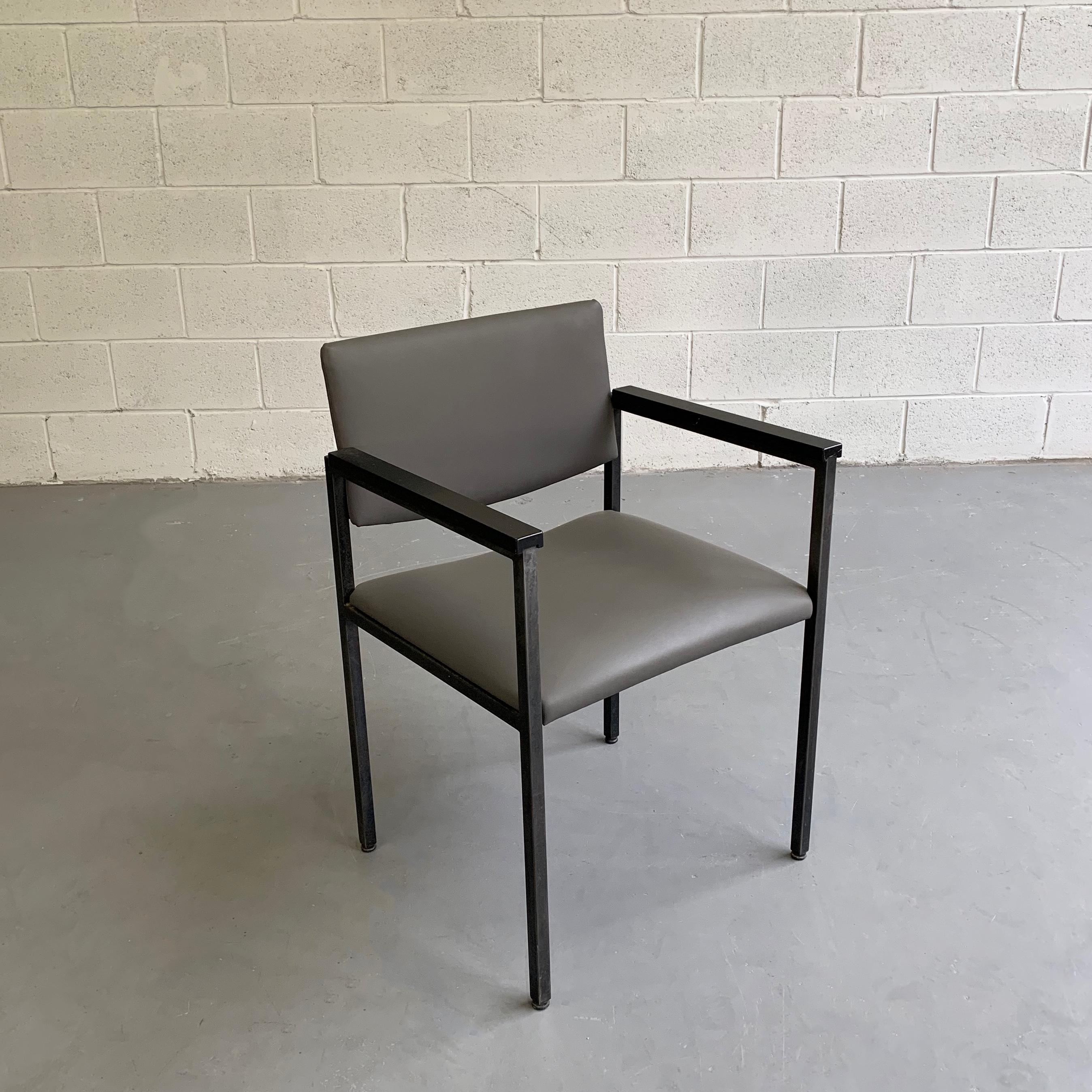 Mid-Century Modern, black, steel frame, armchair is newly upholstered in a medium gray leather.