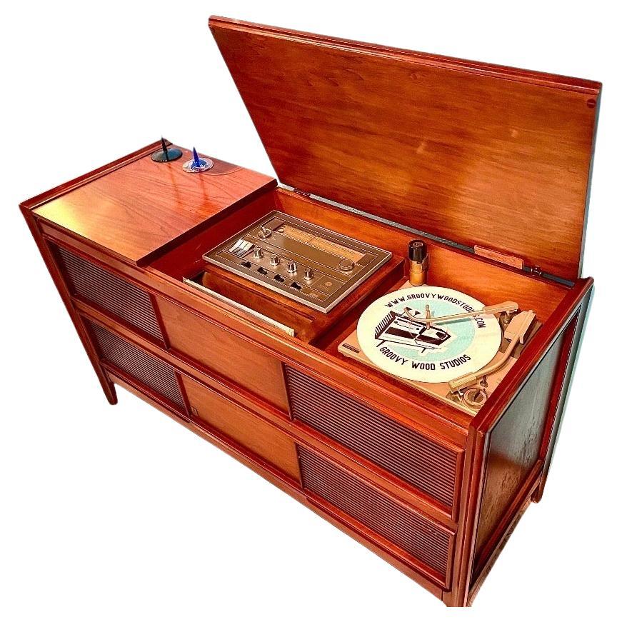“If art decorates space… and music is the art that decorates time, then our vintage stereo consoles decorate lives by accentuating both.”

This console:
This is a console refurbished by us.  We acquire our pieces from very reliable, established, and