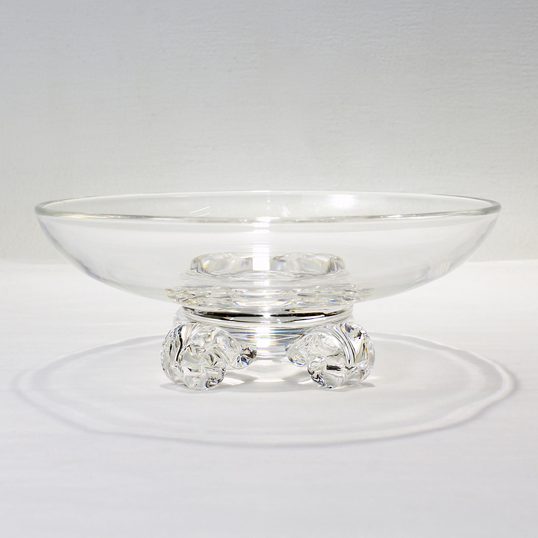 A fine mid-century footed art glass bowl.

By Steuben Glassworks.

Designed by John Dreves.

Model No. 7907

Supported by 4 scroll-shaped feet. 

Simply a great glass bowl from Steuben!

Date:
20th century

Overall condition:
It is