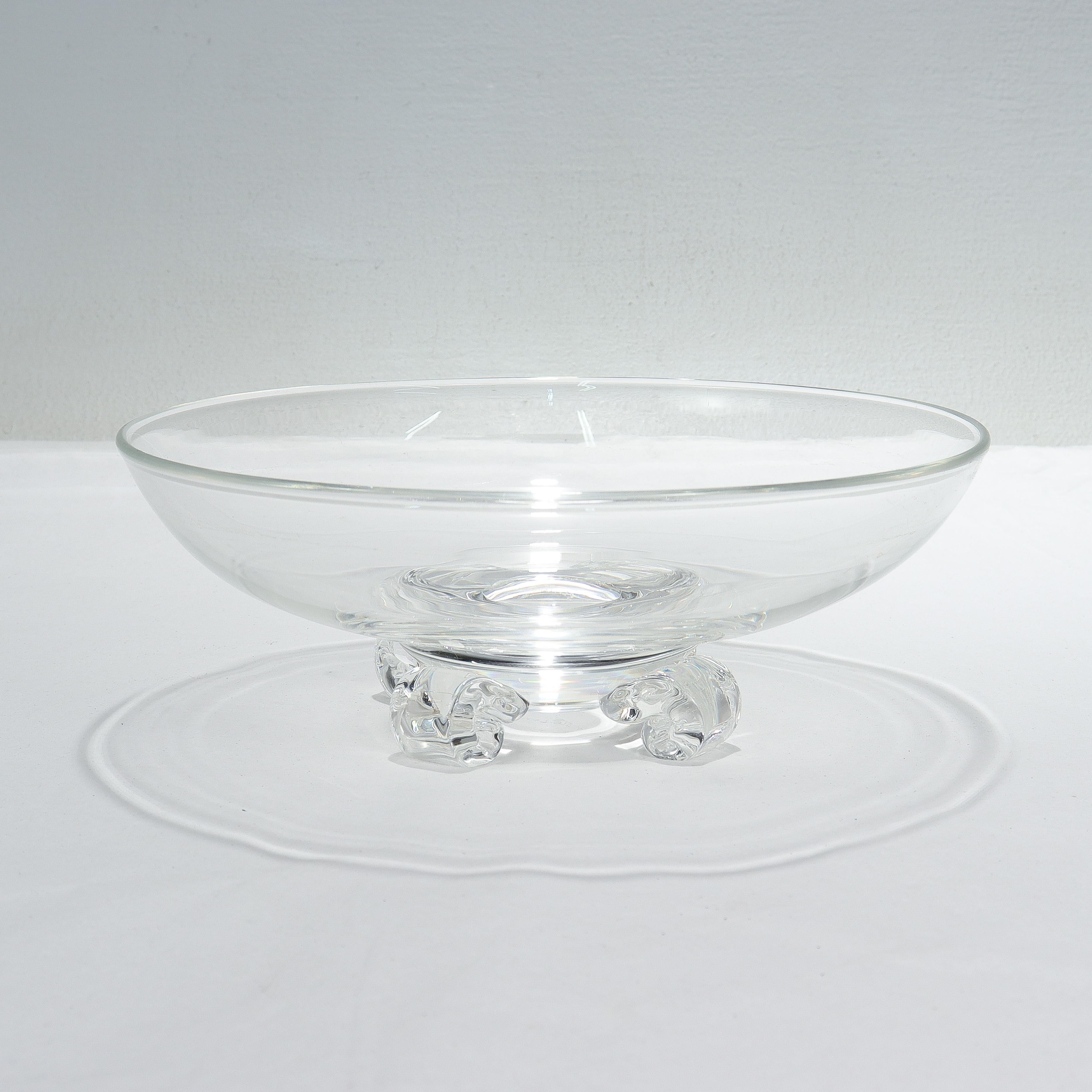 A fine midcentury footed art glass bowl.

By Steuben Glassworks.

Designed by John Dreves.

Model No. 7907

Supported by 4 scroll-shaped feet.

Simply a wonderful bowl from Steuben!

Date:
20th century

Overall Condition:
It is in