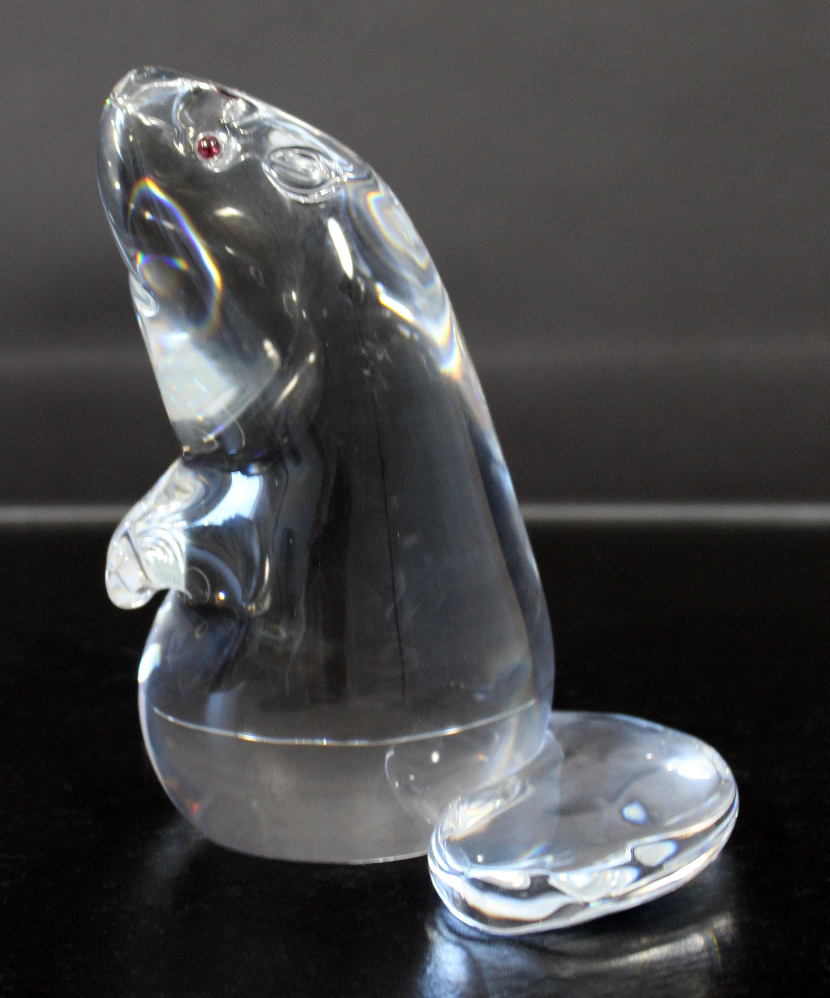 For your consideration is a magnificent, Steuben signed, crystal beaver statue, with garnets for eyes. In excellent condition. The dimensions are 5