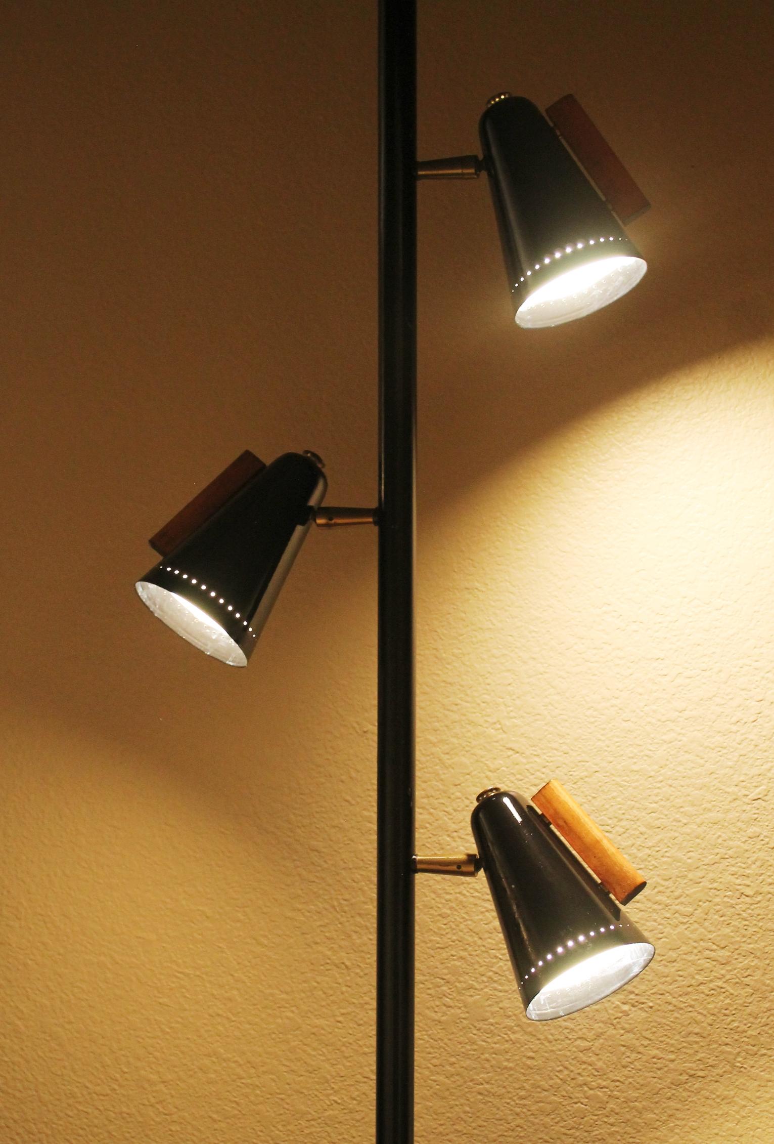 HIGHLY COVETED!
RAYMOND LOEWY
TEAK & METAL ARTICULATING
TENSION POLE LAMP!

CIRCA 1955
FITS 8-1/2 FT. CEILING


Mid Century Pole lamps are one of the most fun interior design additions one can make to a deserving interior! This Stiffel Tension Pole