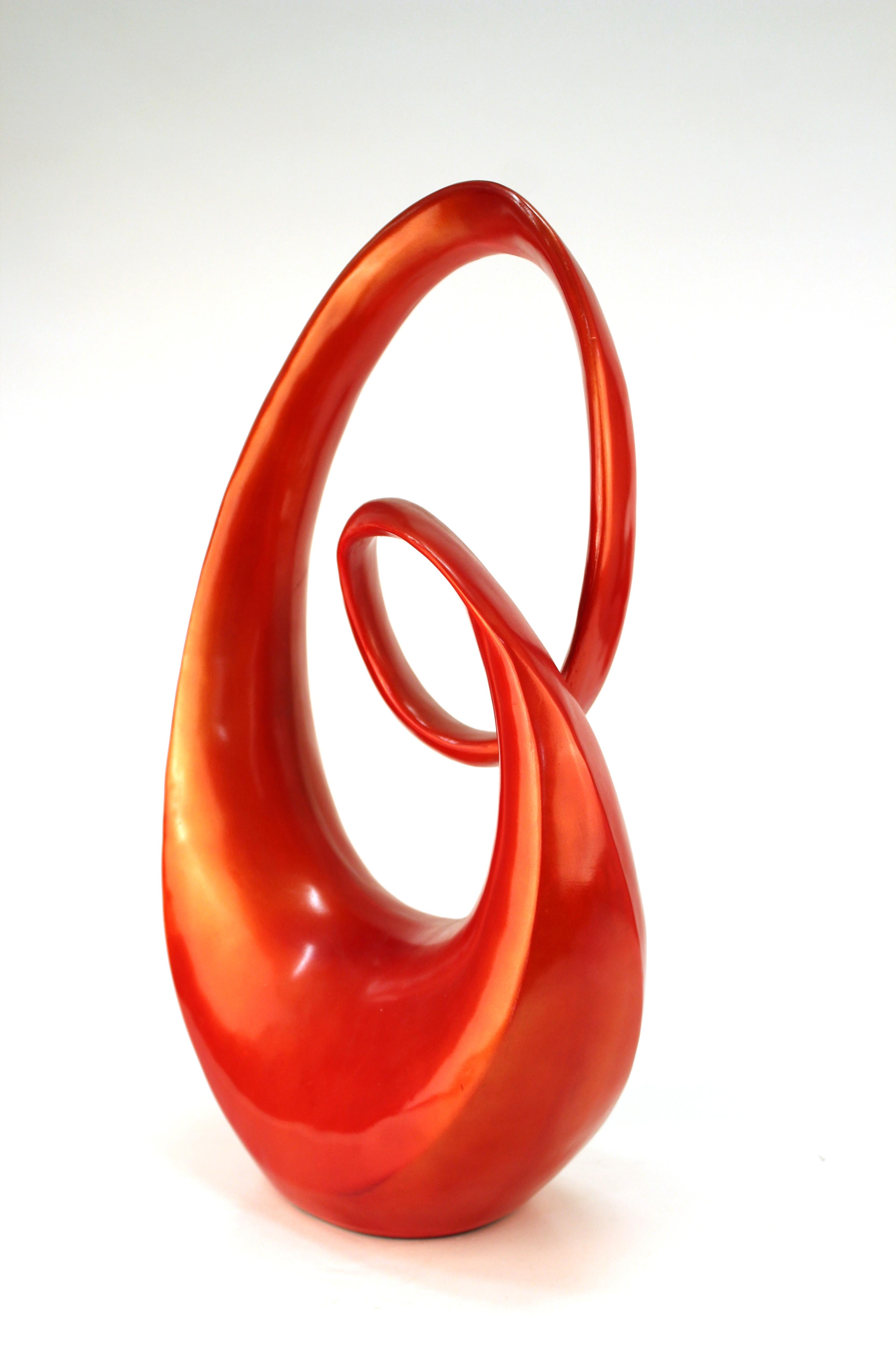 Mid-Century Modern Stohan sculpture with swirly abstract theme, made in red coated resin in the 1970s. The piece is in good vintage condition with age-appropriate wear to the bottom.