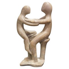 Mid Century Modern Stone Sculpture of a Mother Holding a Child on Her Legs