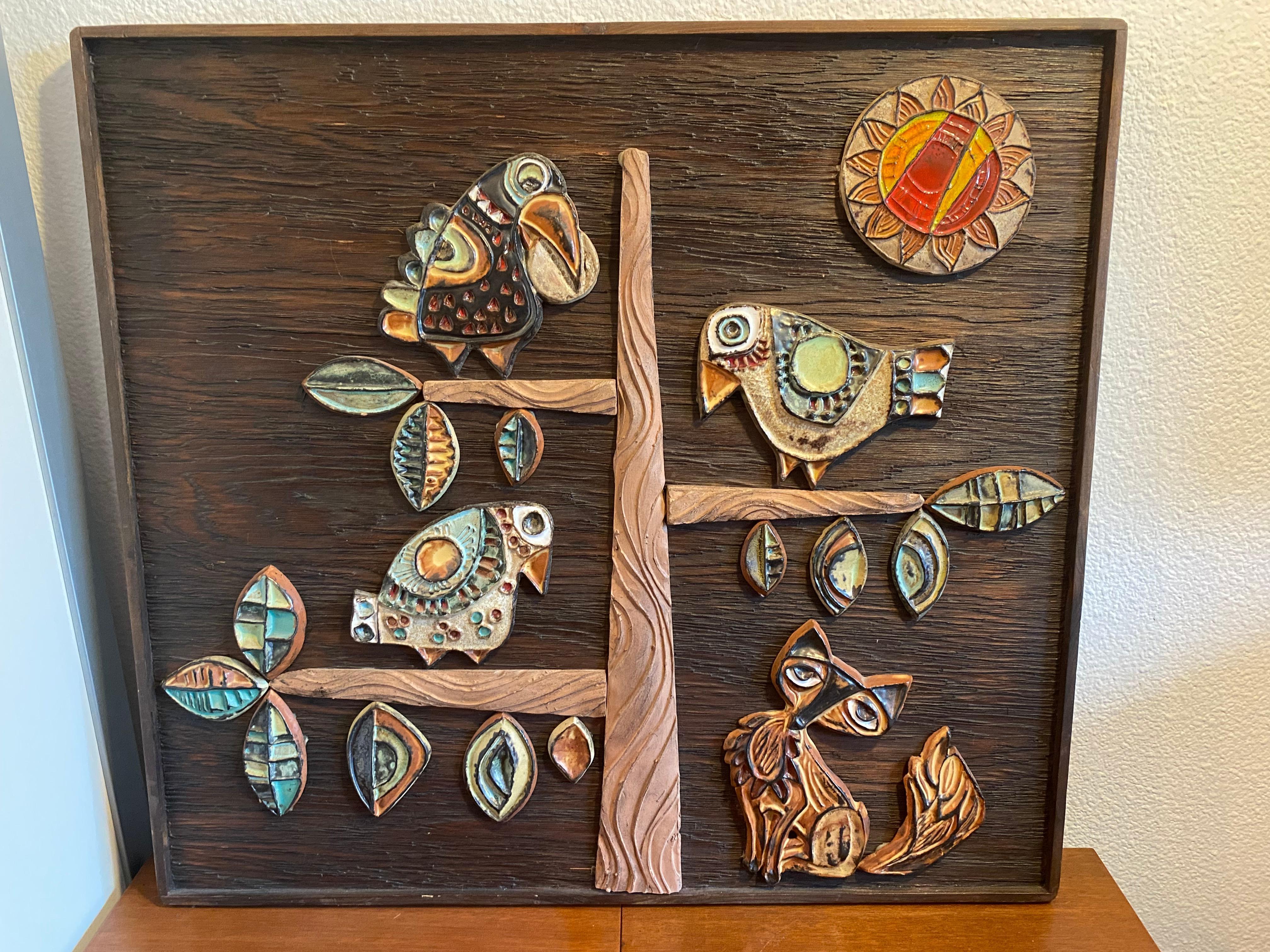 
Sublime ceramic image on wooden wall plaque 1960s relief with beautiful colors.
Roland Zobel (died in 2004), a native of Martinique and son of famous author, Joseph Zobel, he was credited with the rebirth of pottery production in Anduze, France,