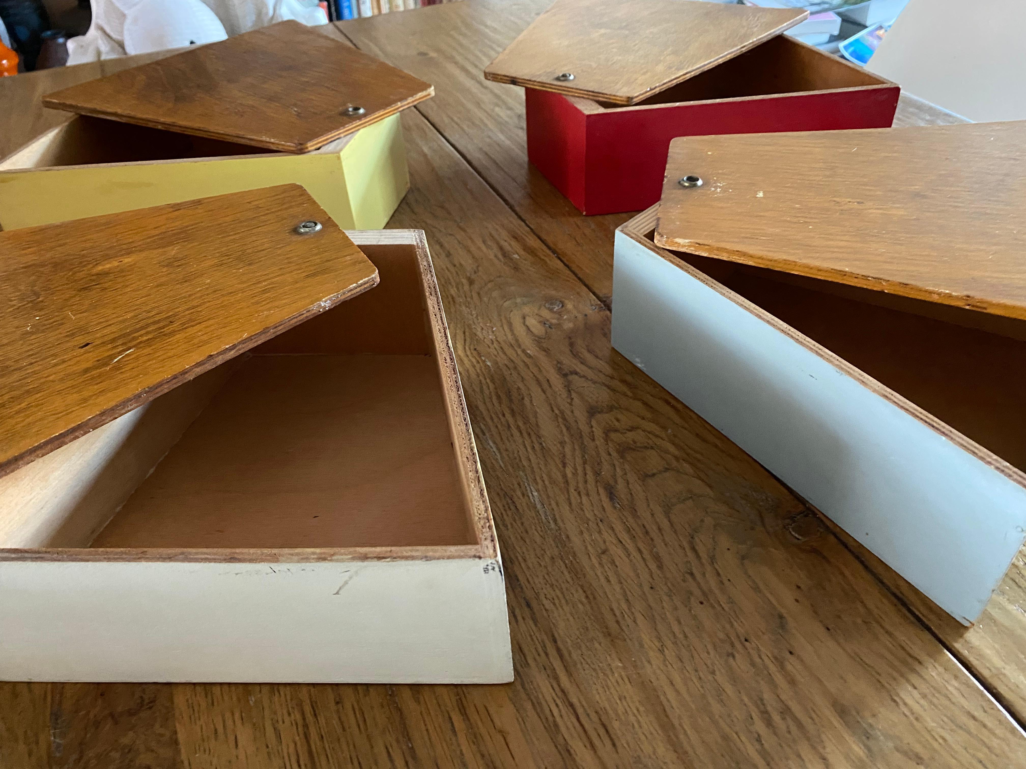 Stylish and decorative sewing box / storage box designed by Joost Teders for Metalux Netherlands in 1955. The original lacquered wooden boxes colored in soft pastels are very nice in contrast to the birch plywood tops. These tops swivel to open. The