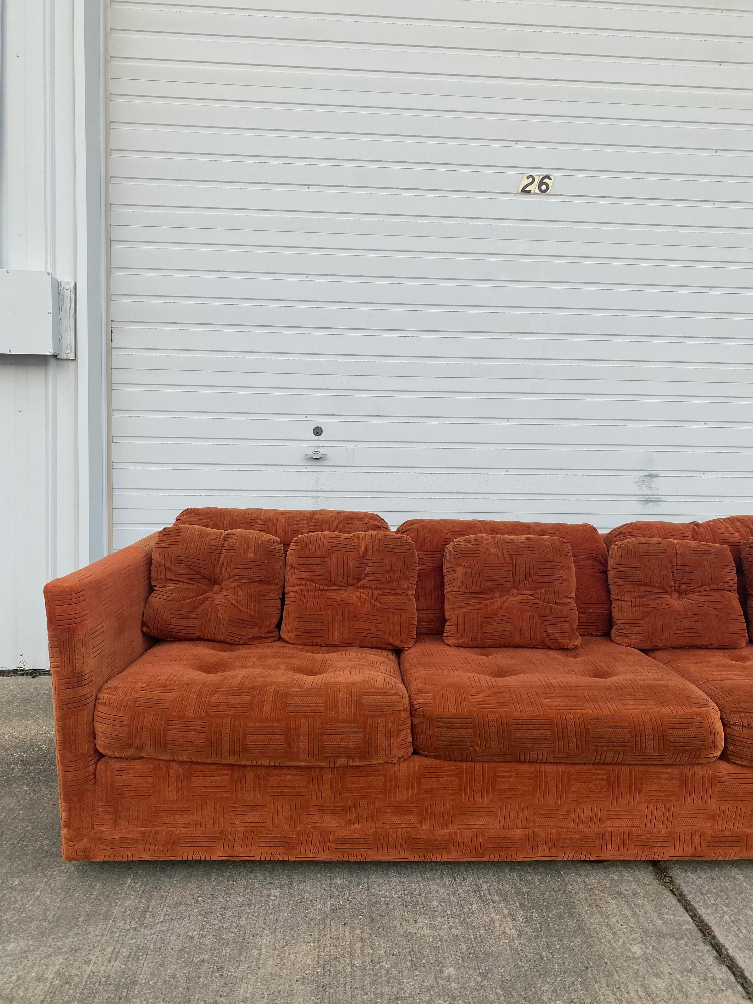 Mid-Century Modern Stratford tuxedo 3-seater sofa. Has some amazing bones to become a beautiful sofa with its matching pair (see listings). The velvet fabric does hold some stains and sun fading (it does come with arm covers) due to age, we do