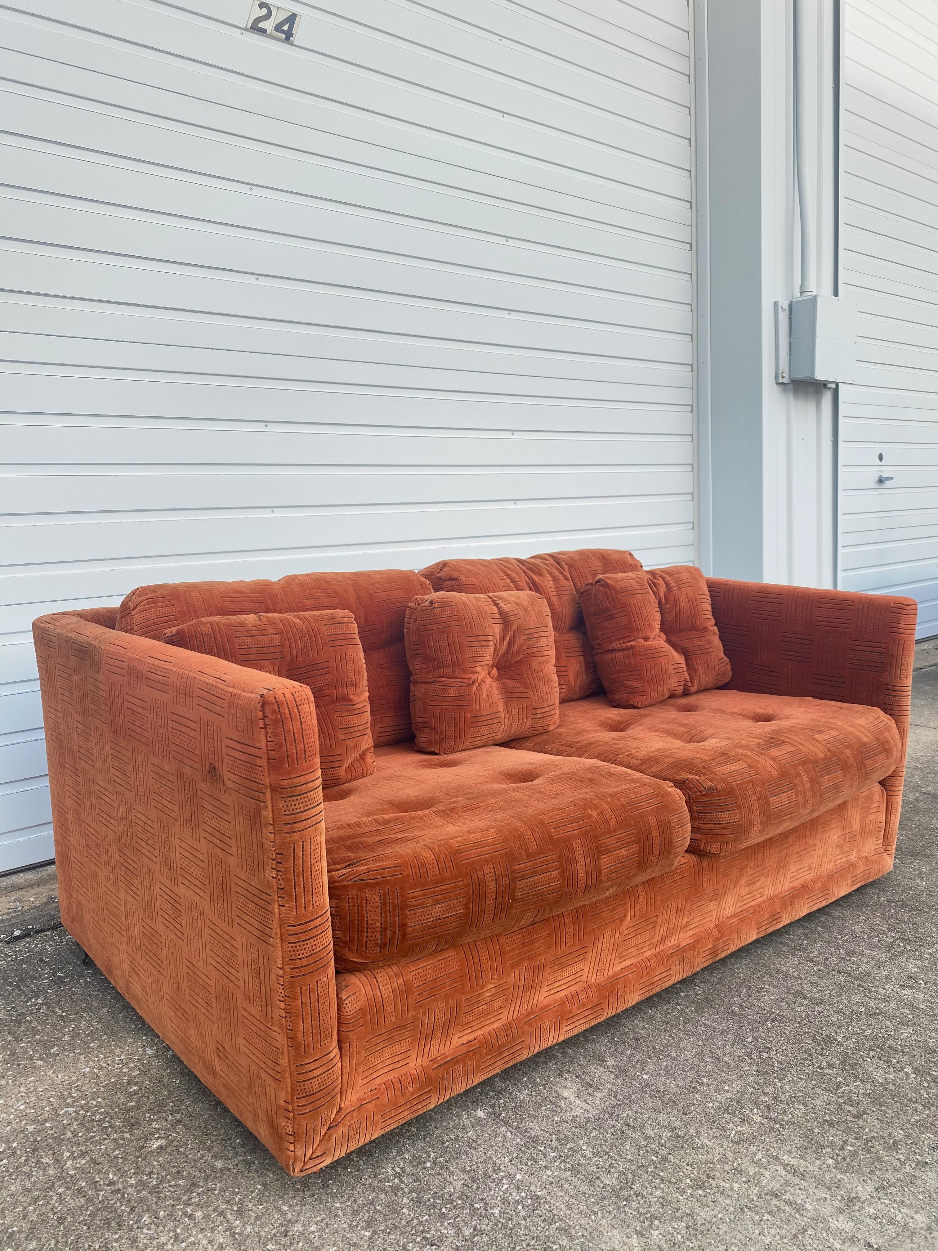 Mid-Century Modern Stratford tuxedo loveseat sofa. Has some amazing bones to become a beautiful sofa with its matching pair (see listings). The velvet fabric does hold some stains and sun fading (it does come with arm covers) due to age, we do