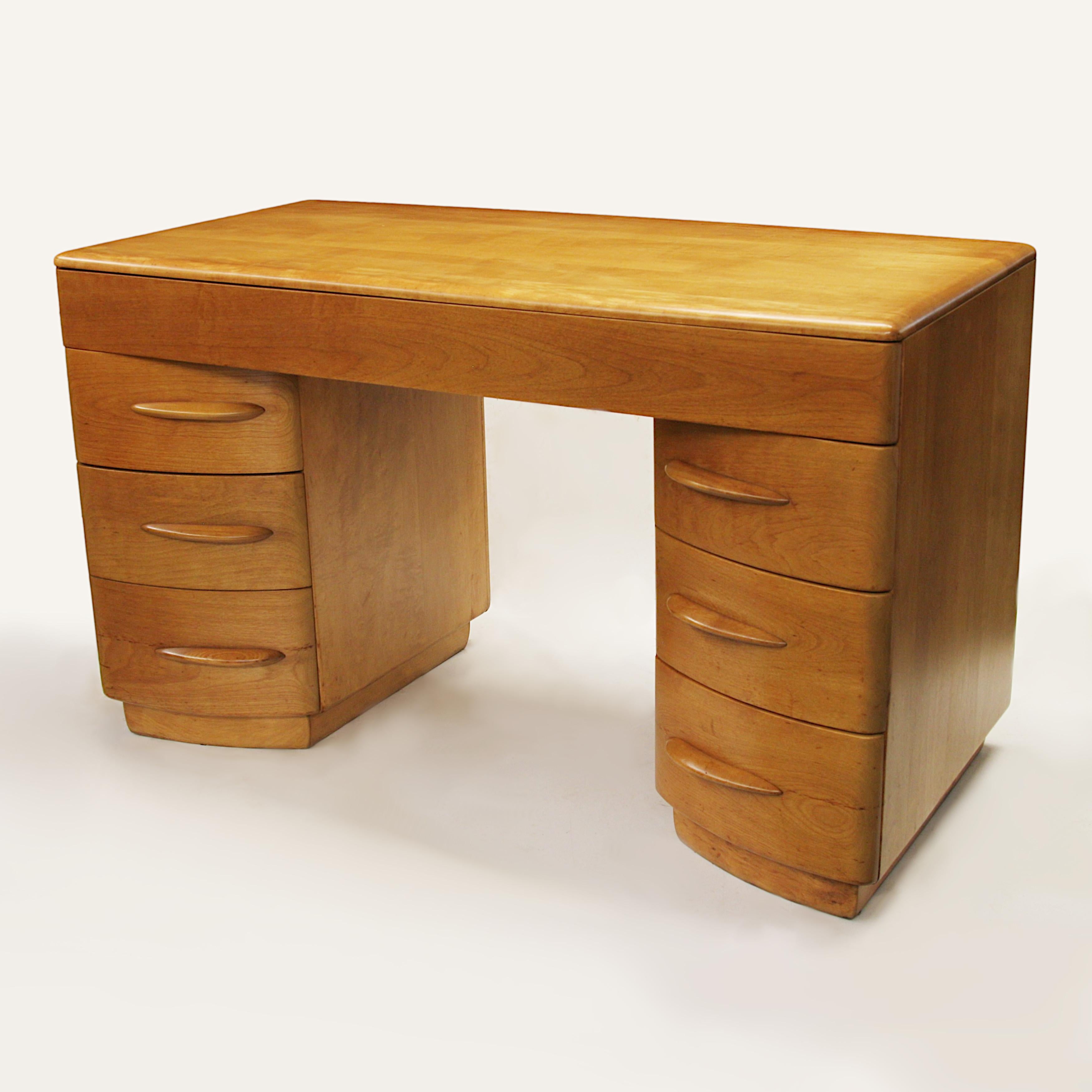 Wonderful streamlined desk by Count Alexis de Sakhnoffsky for Heywood Wakefield. The count was famous for his wonderfully stylized Industrial designs and worked with major automakers of the day like Auburn, Cord, Packard, Tucker and the White Truck