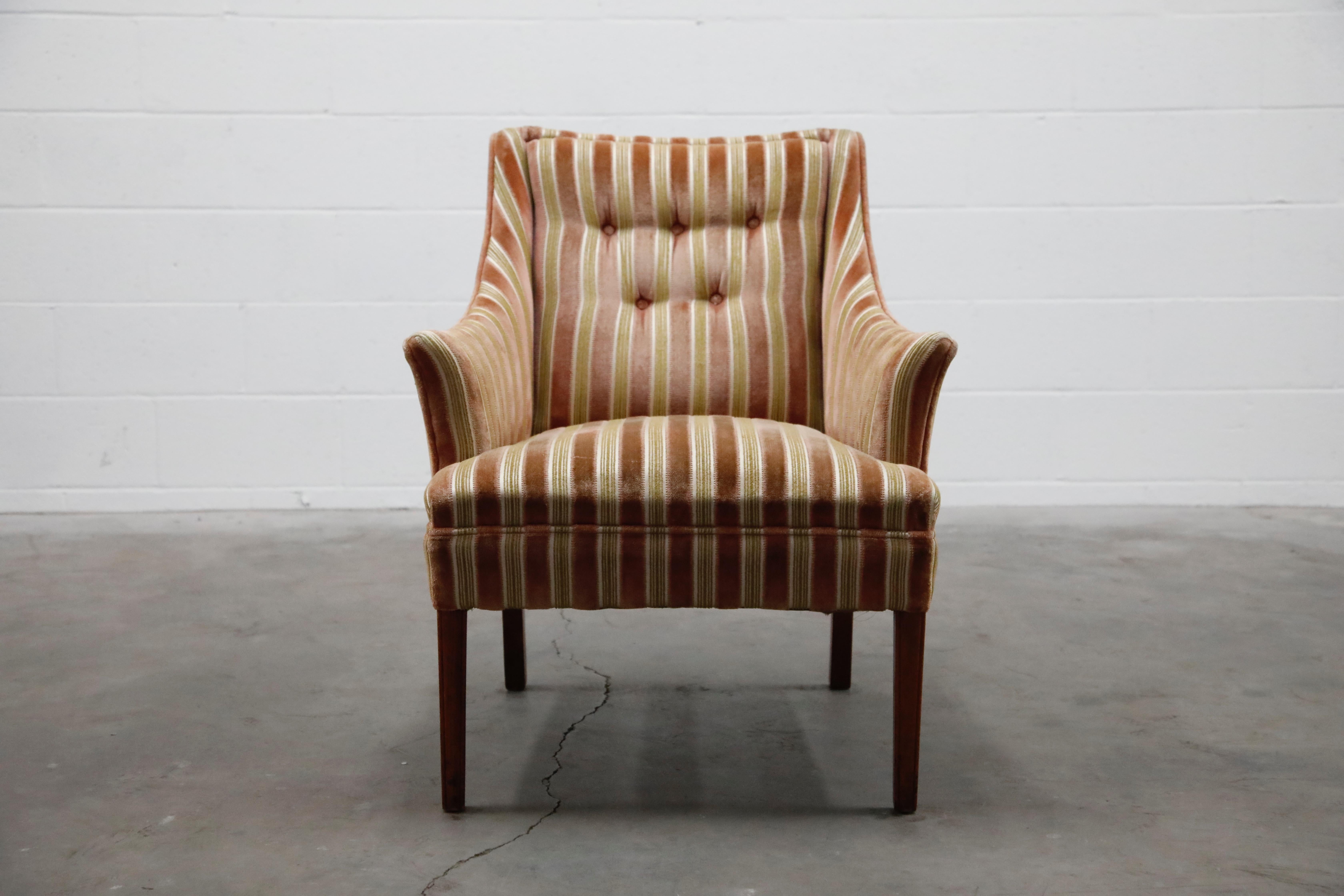 This lovely fireside armchair is upholstered in a beautiful soft striped velvet. Gorgeous striped colors of olive green, white and salmon pink. Sophisticated and classy, soft and cozy - this comfortable armchair is the perfect companion for a good