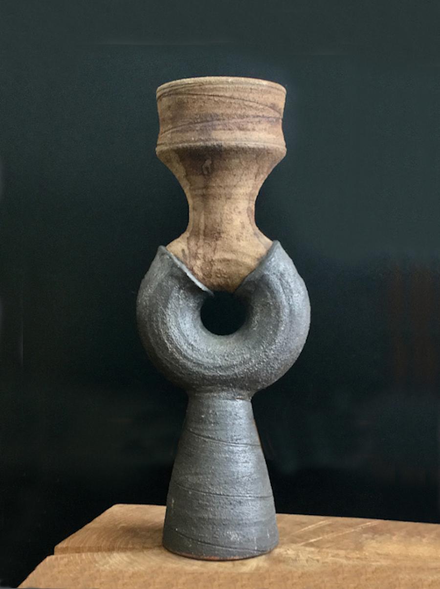 Studio ceramic sculpture by Clive Brooker, mid-20th century, England.

Handmade pottery, with strong silhouette and Brutalist feel. The lower surface is charcoal in color - deep grey/brown - and the upper is brown; both have a matte finish and the