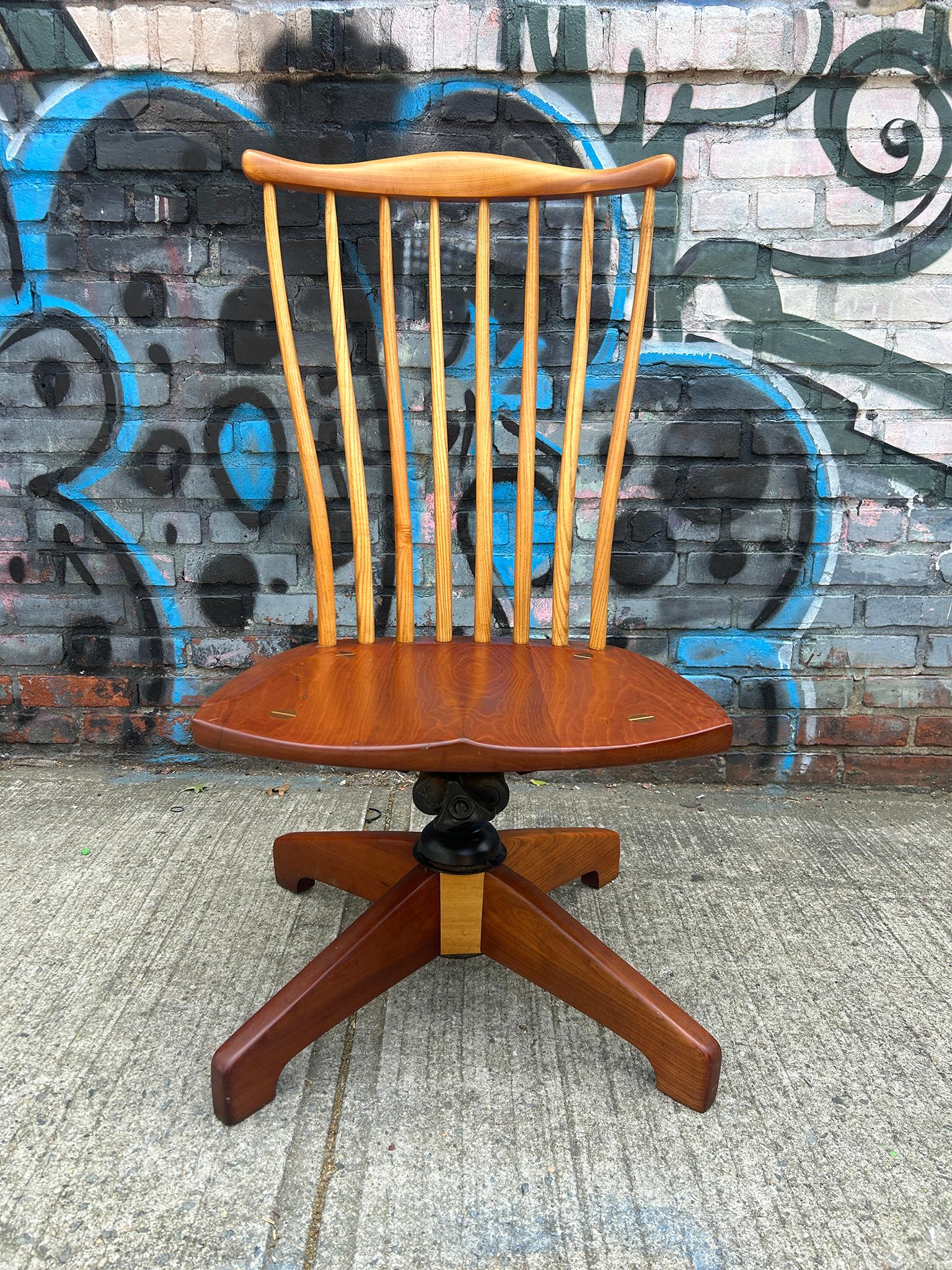 Mid-Century Modern Studio Craft Arts Swivel Spindle Back chair in the style of Thomas Moser woodworker. Has 4 point base that has steel office chair reclining springs and manual adjustable seat height. Chair also swivels 360 degree. Great high