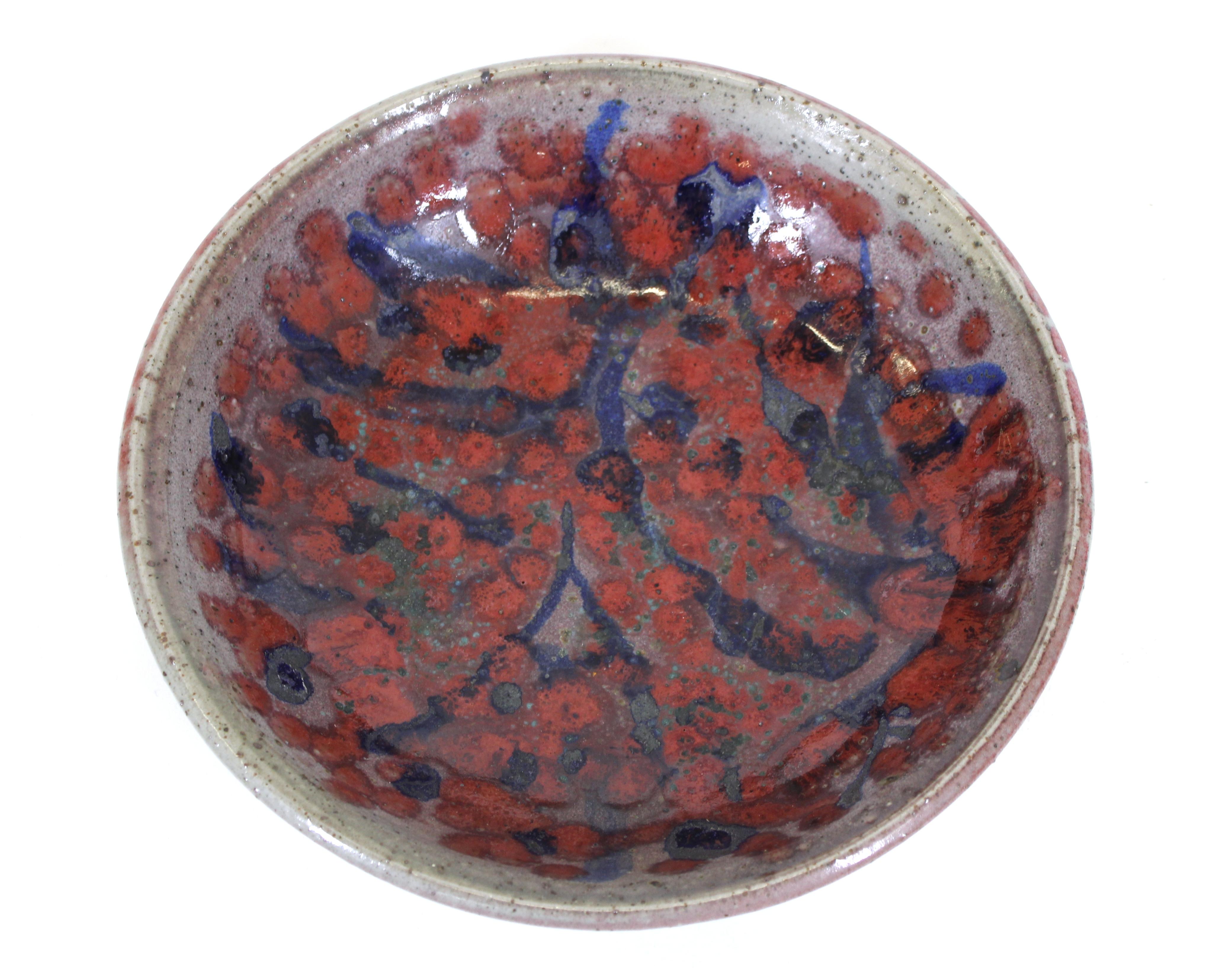 Mid-Century Modern studio pottery glazed stoneware bowl with floral design.