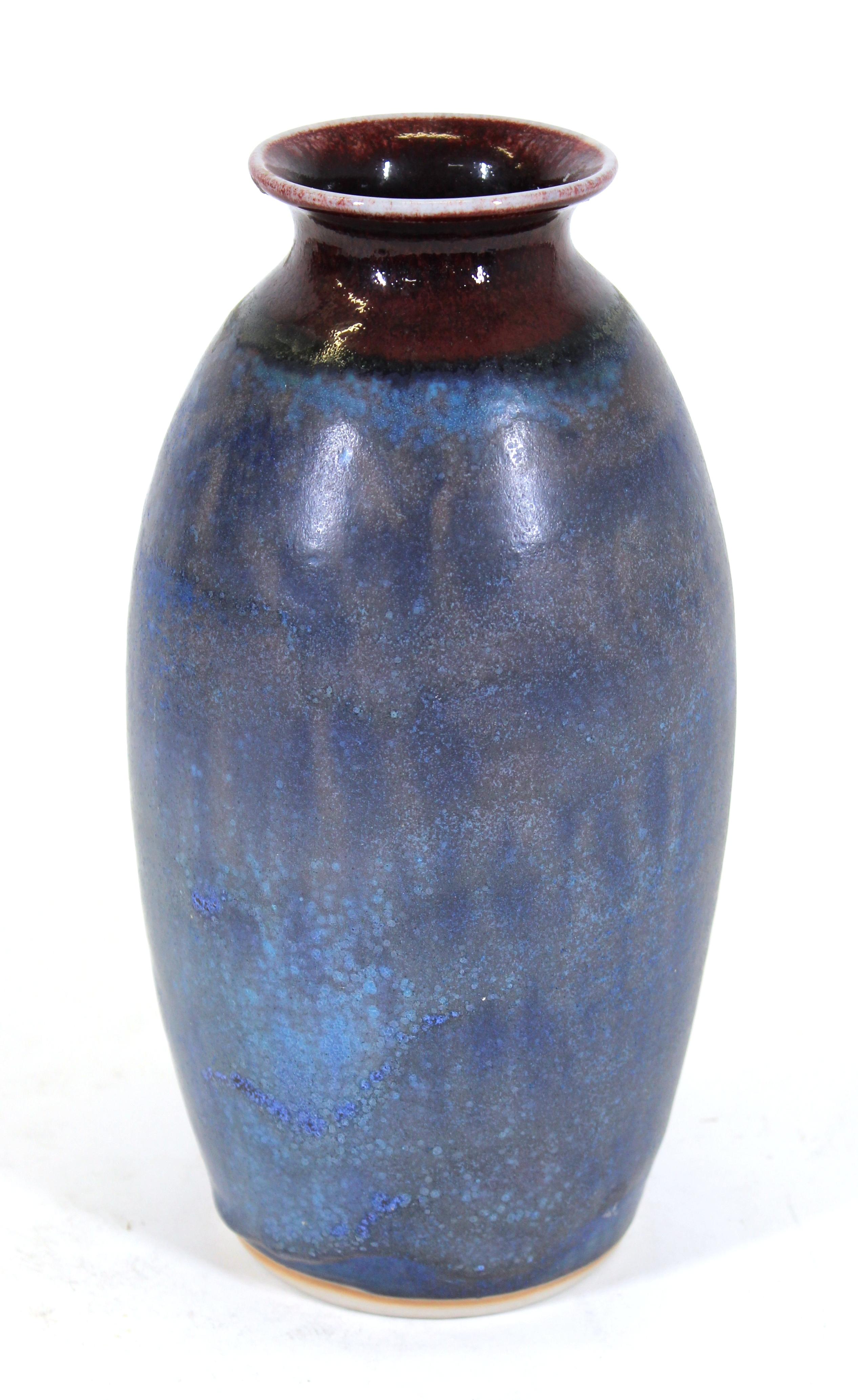 Mid-Century modern studio pottery vase in blue with burgundy red lip, marked on the bottom, possibly Japanese.