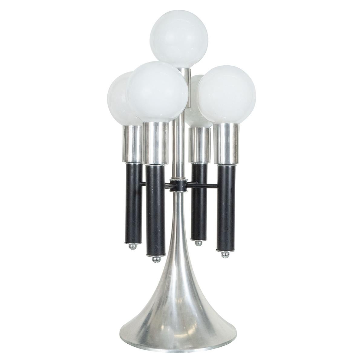 Single aluminum table lamp with black enameled metal details and integrated switch at base. Light bulbs not included.