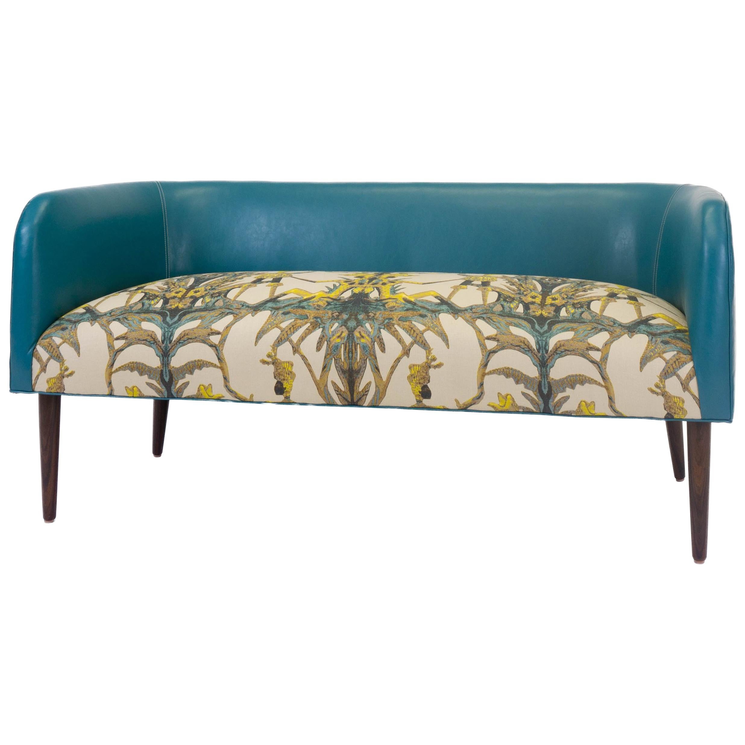 Petite banquette/bench made of solid hard maple is inspired by Mid-Century Modern design. The tight seat bench made with a high density cushion, sitting atop 8-way hand tied springs, features colorful combinations of fabrics. The back is upholstered