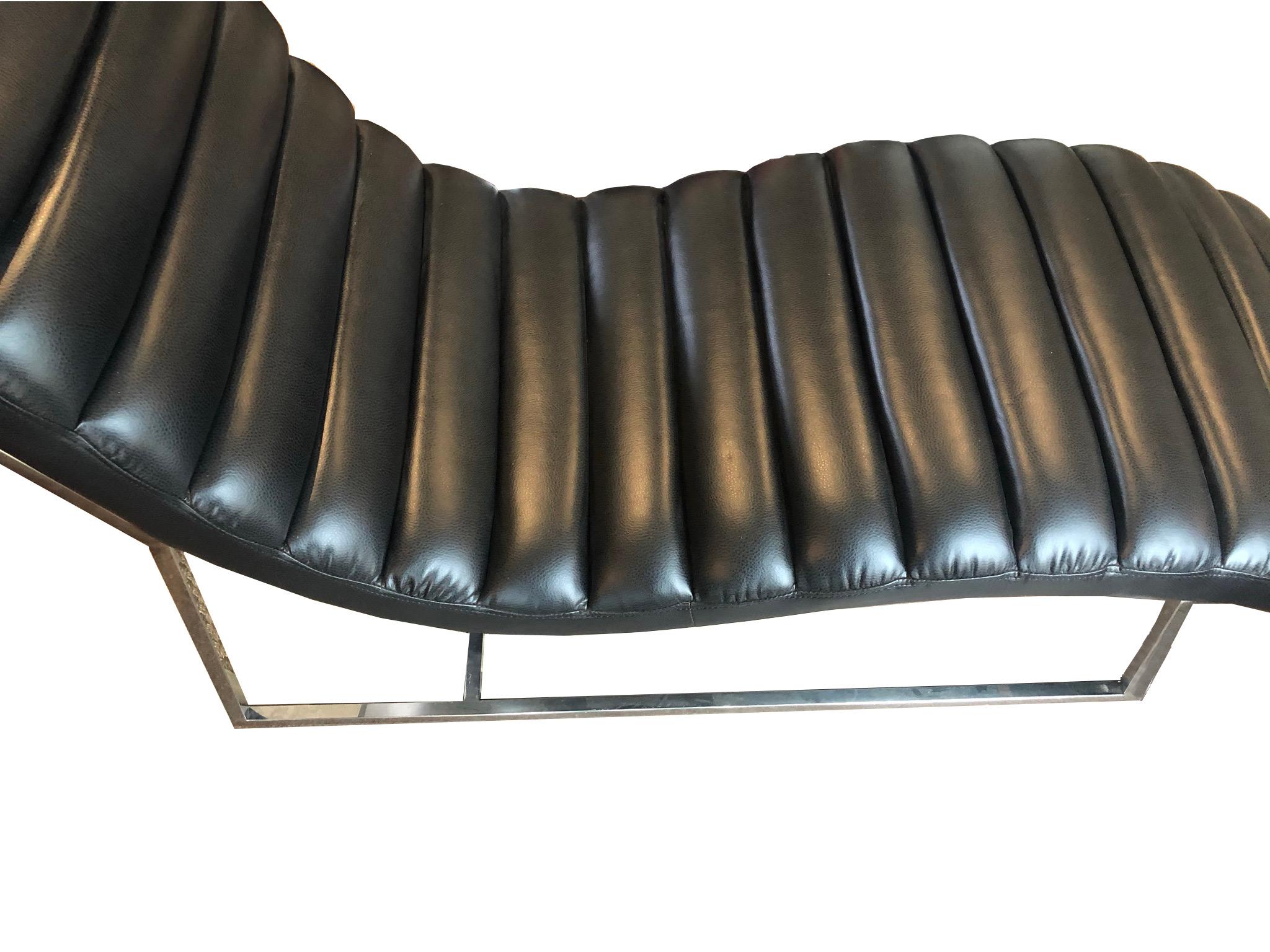 Uber cool channel leather chaise lounge with chrome legs. Modern piece in the style of the midcentury masters such as Le Corbusier. Excellent condition and wonderfully comfortable, this chaise is perfect for any place one wants to be stylish or take