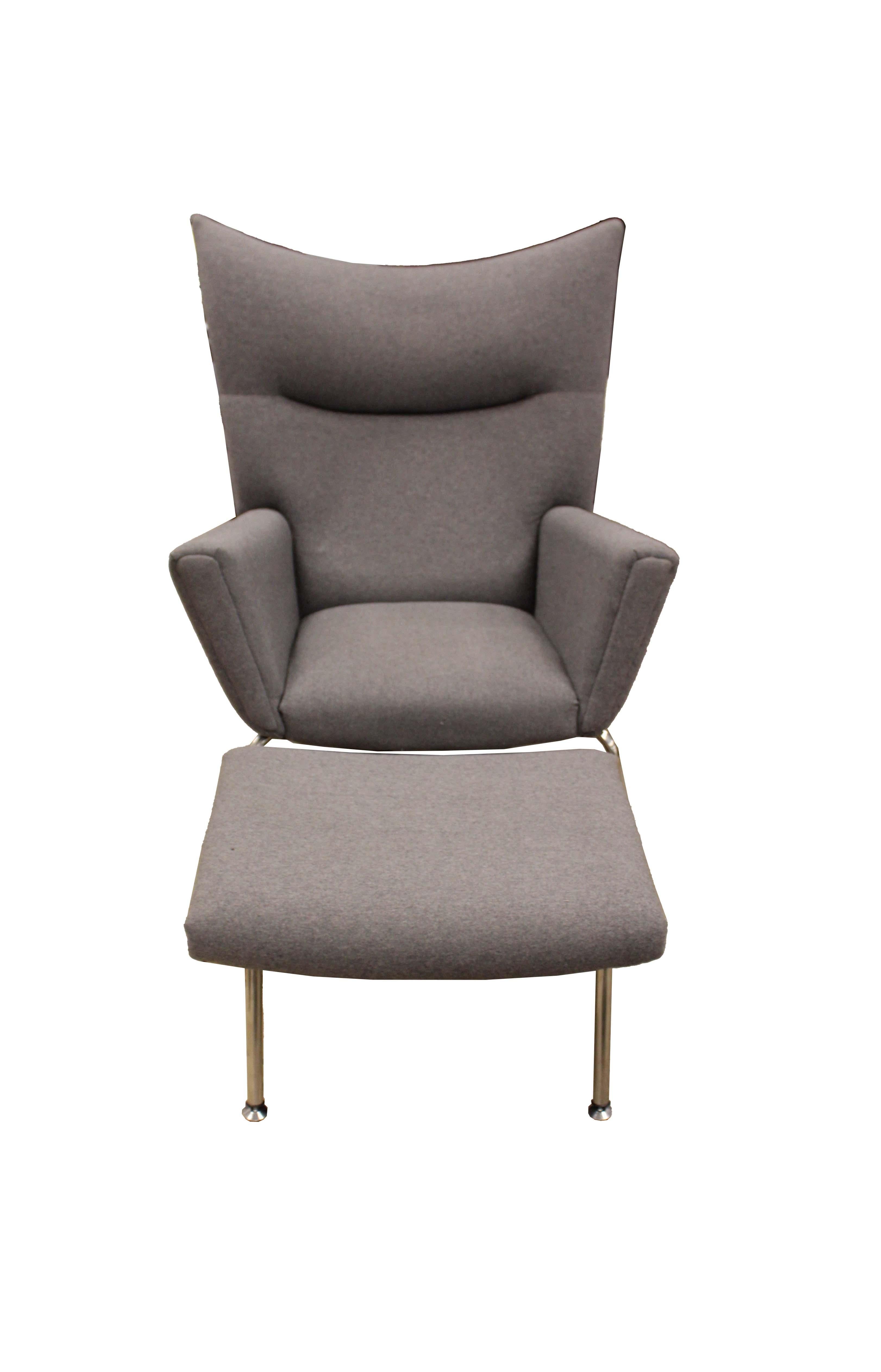 This Carl Hansen and Søn style chair up for consideration. The dramatization of the winged back gives this chair an incredible structural dynamic. The structure and texture of the chair in addition with the ottoman allows this chair to give a