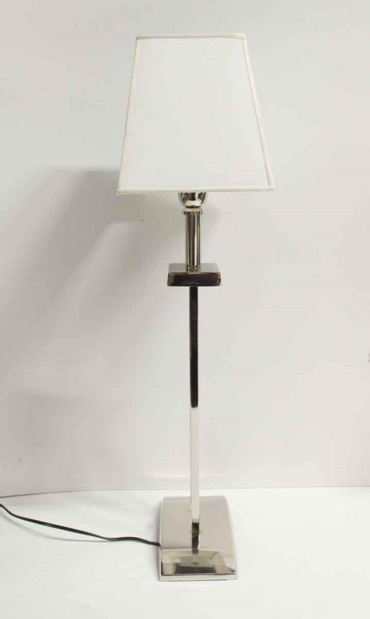 Mid-Century Modern chrome plated table lamp with a modern white shade. Small quantity available at time of posting. Please inquire. Priced each. Does not include lampshade. Please note, this item is located in one of our NYC locations.