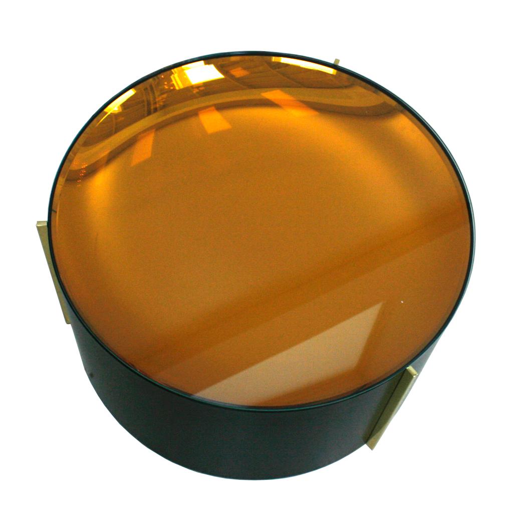 Contemporary Italian coffee table. Cylindrical structure made of black lacquered metal and brass details. 
Composed of concave orange colored mirror and clear glass on top.