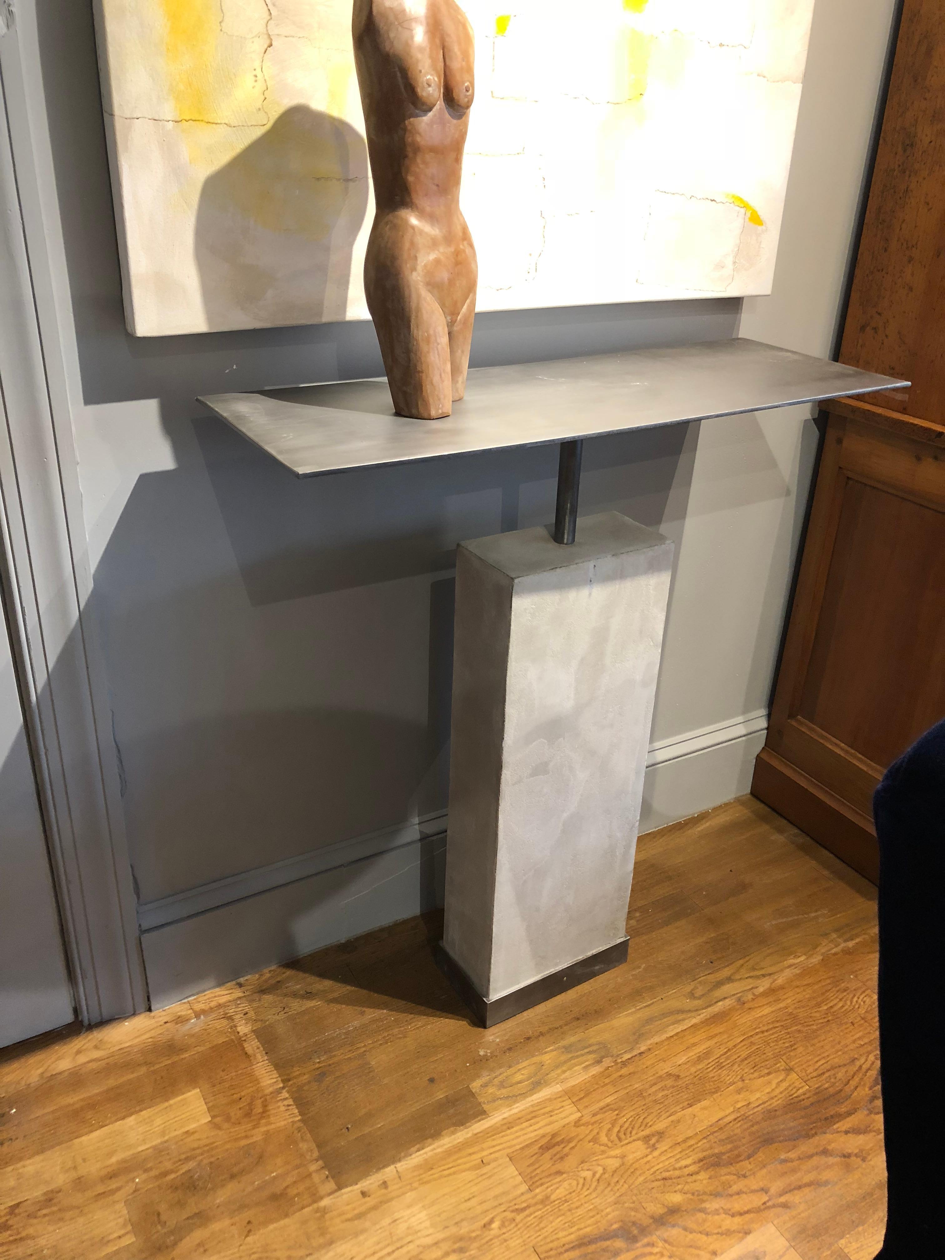 Mid-Century Modern style console table made of limestone with brushed steel tops. This sturdy industrial style table is a perfect display piece for your gorgeous pieces of art. Custom designed and fabricated by Hastening Designs. 
Measures: 36