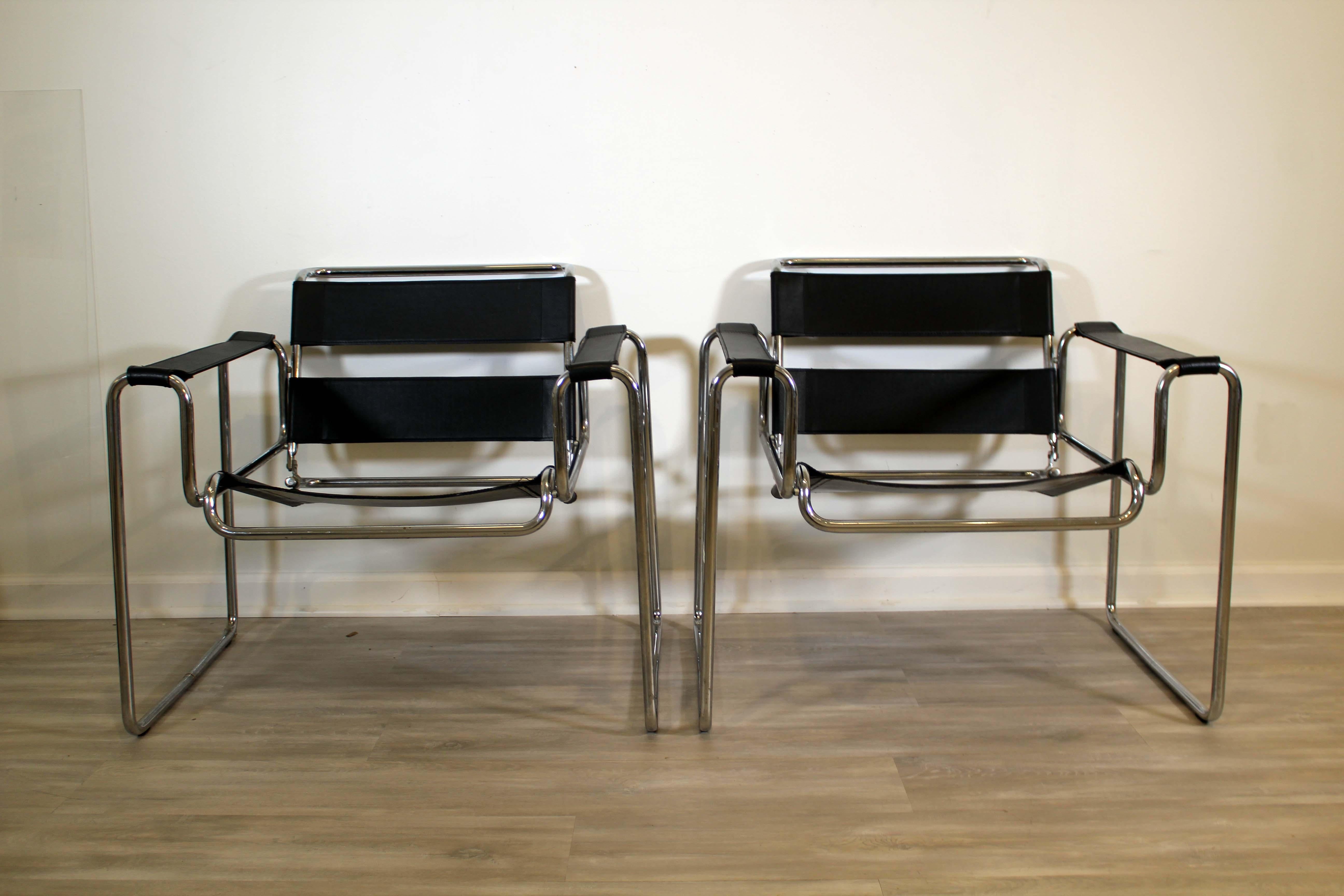 These pair of Black Wassily style chairs are up for consideration. The pair gives the same look and feel of the original constructivist De Stjil art movement pieces. The chrome and black give it the sleek and professional feel that would look