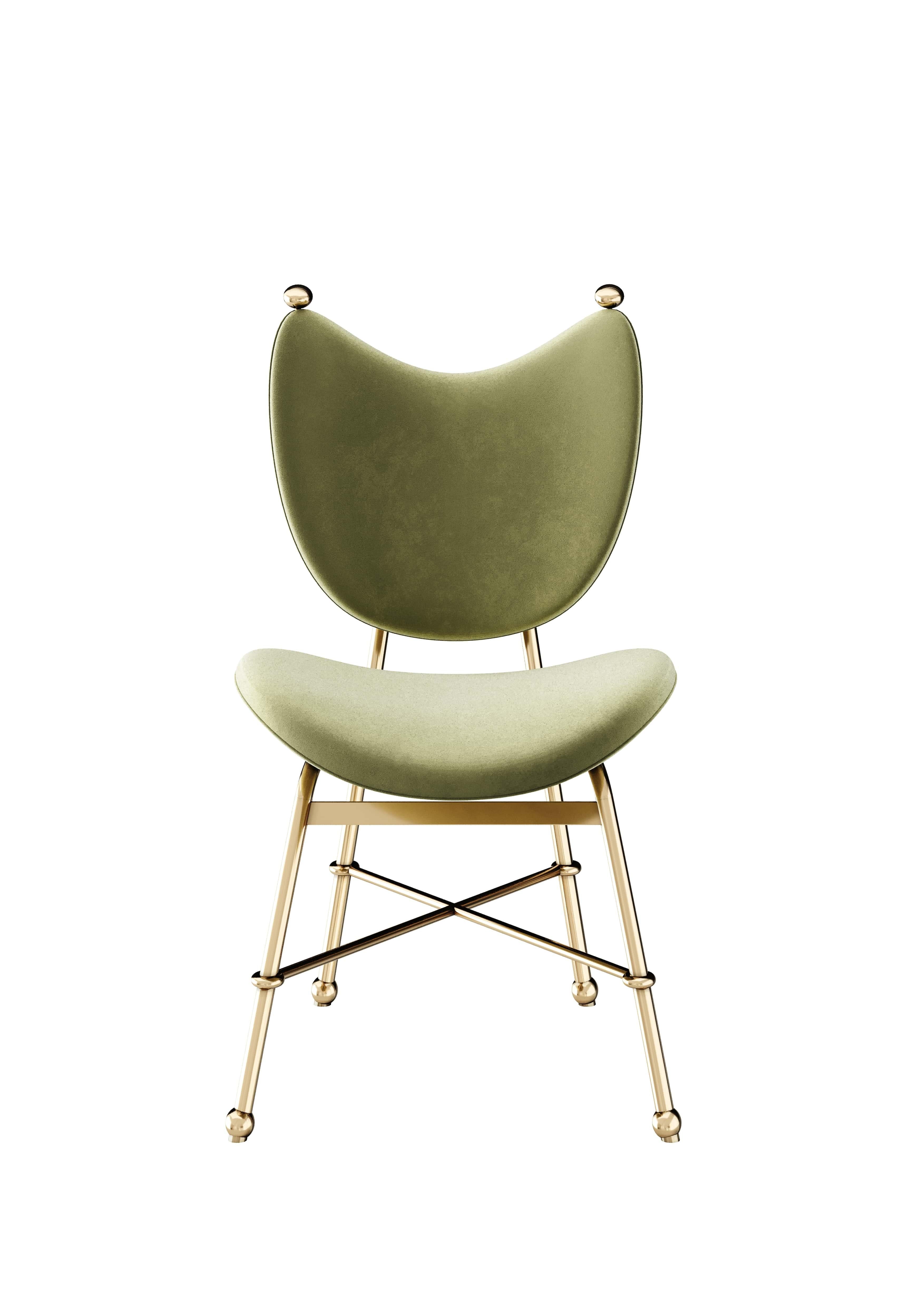 Samira Dining Chair is sophisticated in the shape of a chair. This modern dining chair is upholstered matches wonderfully in any contemporary or luxury dining table.

Materials: Upholstered in Velvet; Structure in Polished Brass.

Dimensions: 48 cm