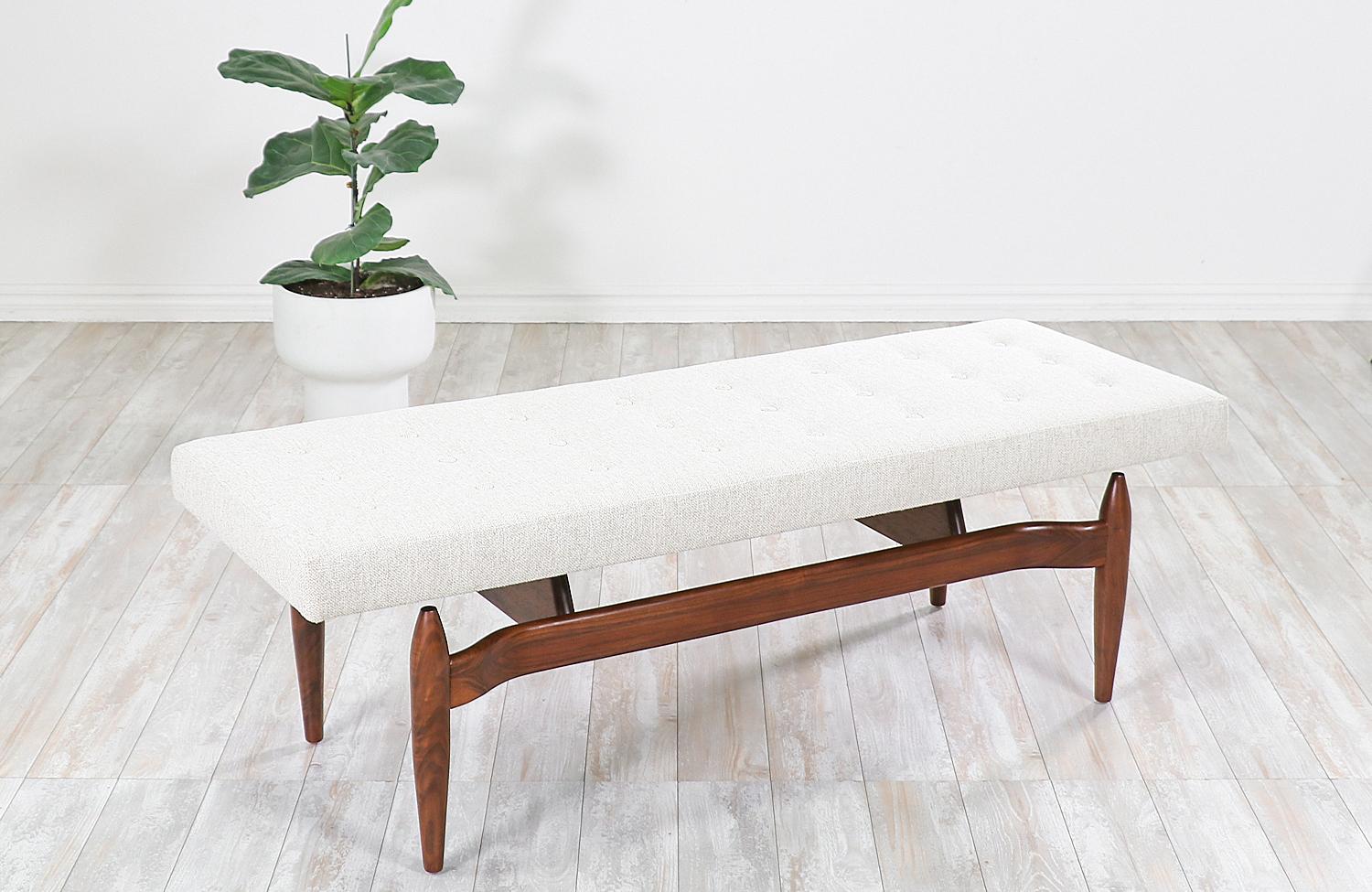 Introducing our first-ever modern bench designed and crafted by Danish modern L.A.'s artisans' house in Los Angeles, CA. Our skillfully crafted bench is made from American walnut that features a floating aesthetic and sculpted taper legs. Its tufted