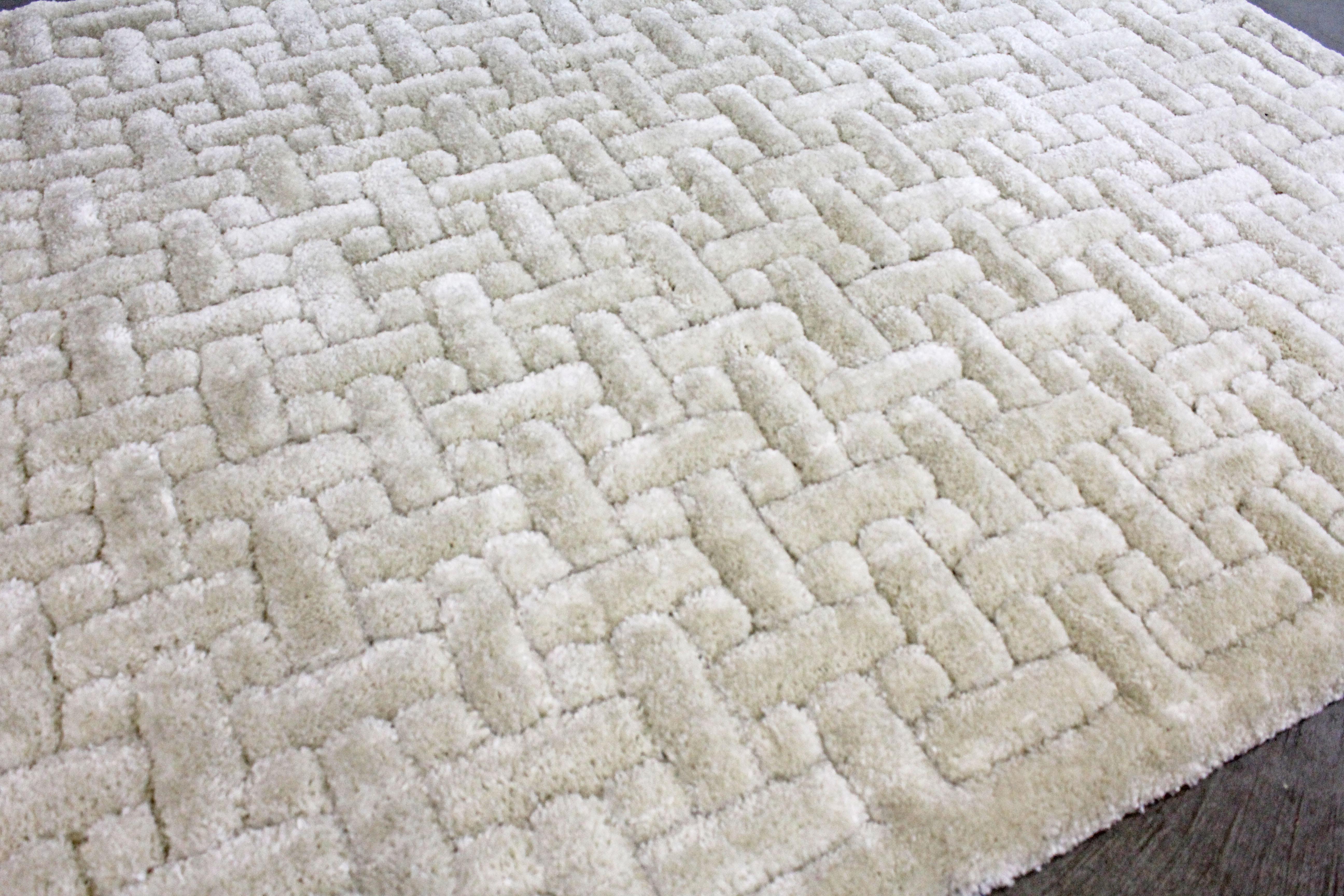 Offered is a Mid-Century Modern style off-white room size rug with a geometric pattern design. This piece is quite thick, approximate 1.5