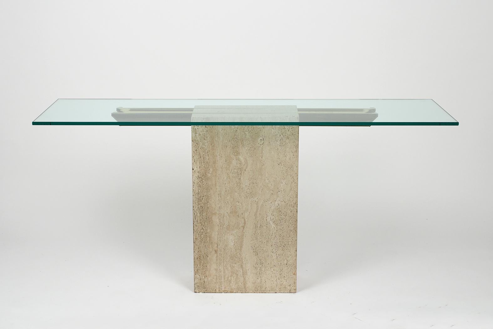This Mid-Century Modern Style Console is in great condition and features a Travertine pedestal base with two brass inserts bar embedded across the top. On top of the console, base rests a new 1/2 inch clear tempered glass with a flat polished finish