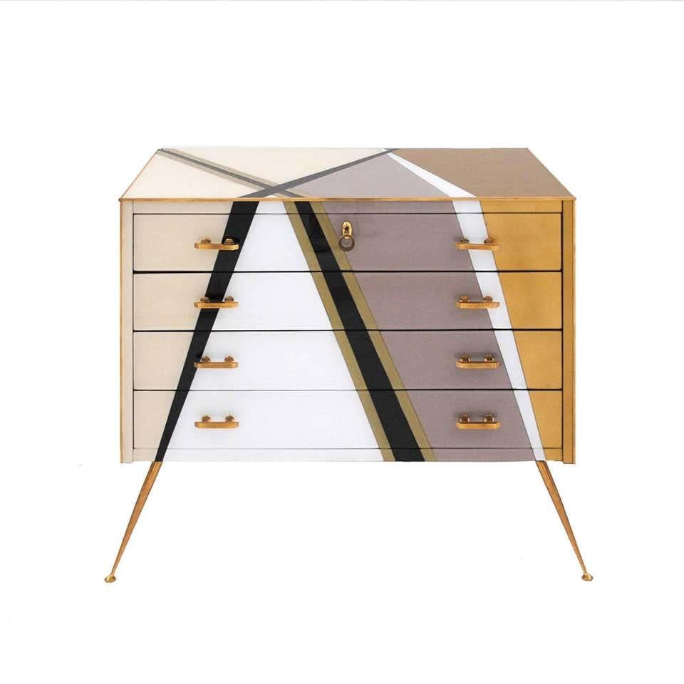 Contemporary commode composed of four drawers designed by L.A. Studio. Original wood structure from 1950s covered with colored glass. Handles, legs and details are made of solid brass.

Our main target is customer satisfaction, so we include in