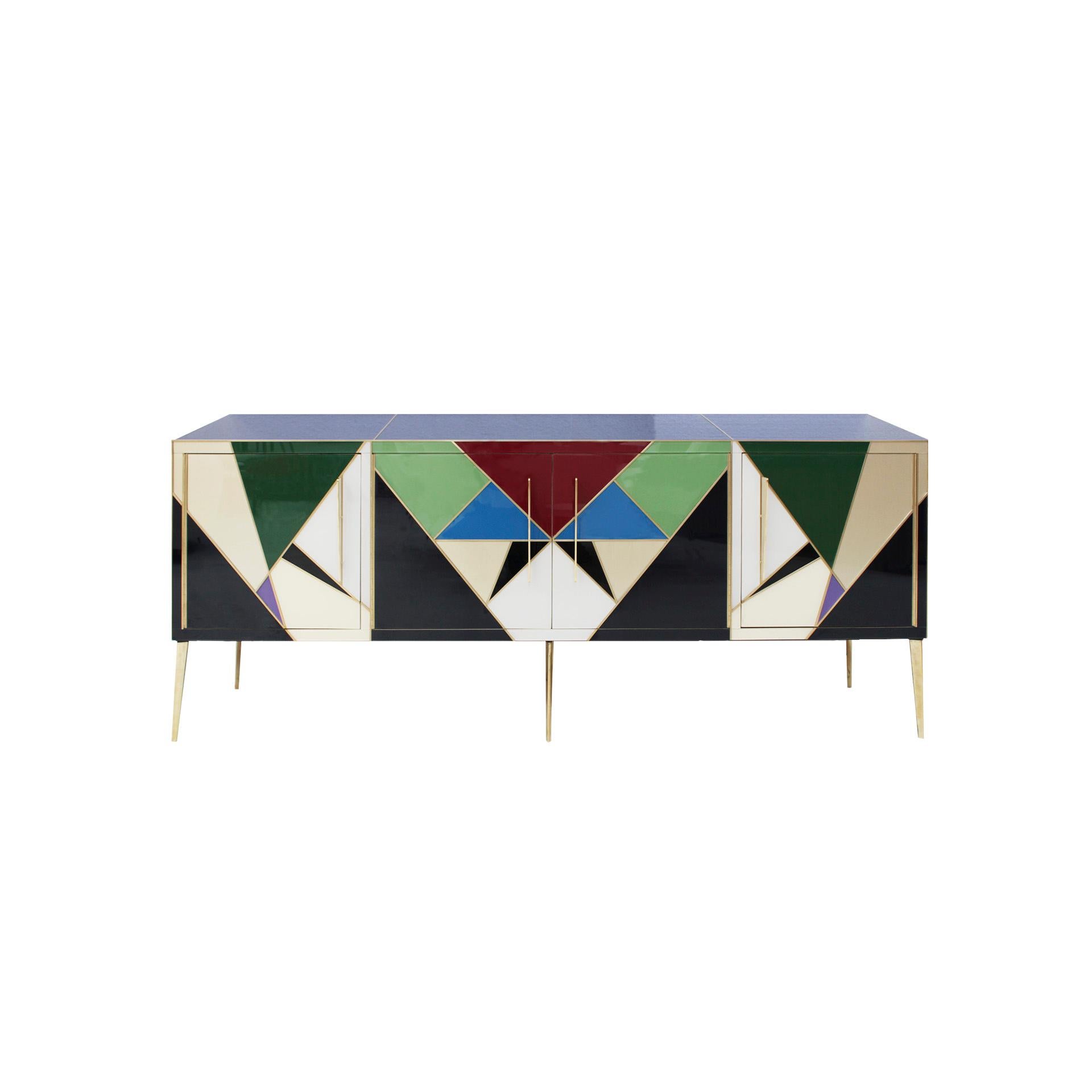 Sideboard with four folding doors made with an original solid wood structure from the 50s, covered in colored glass and brass profiles, handles and legs. Italian manufacture.