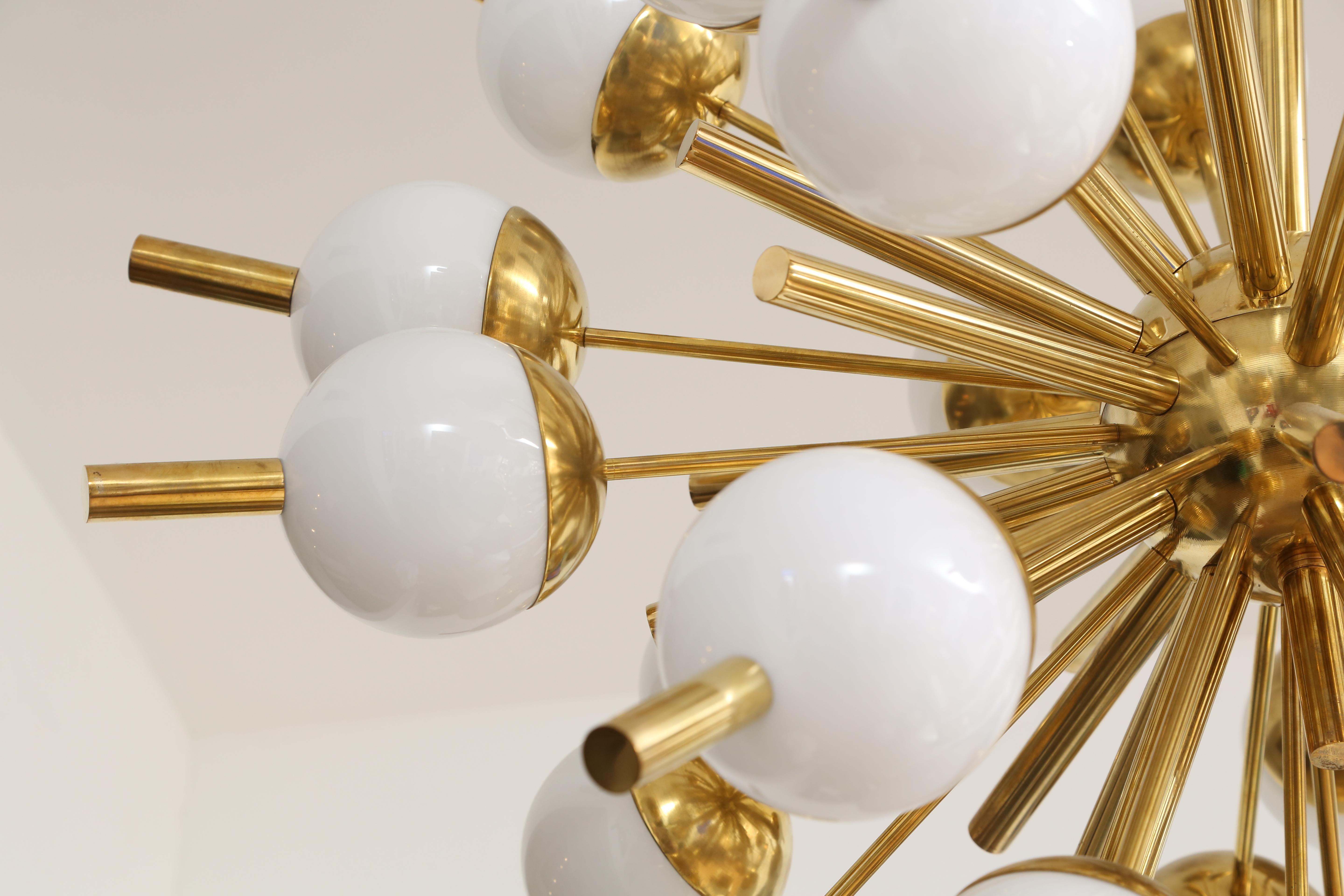 Large contemporary Italian sputnik chandelier, with brass structure and 30 white glass orbs. Drop can be adjusted to your own specification.
Pair available.