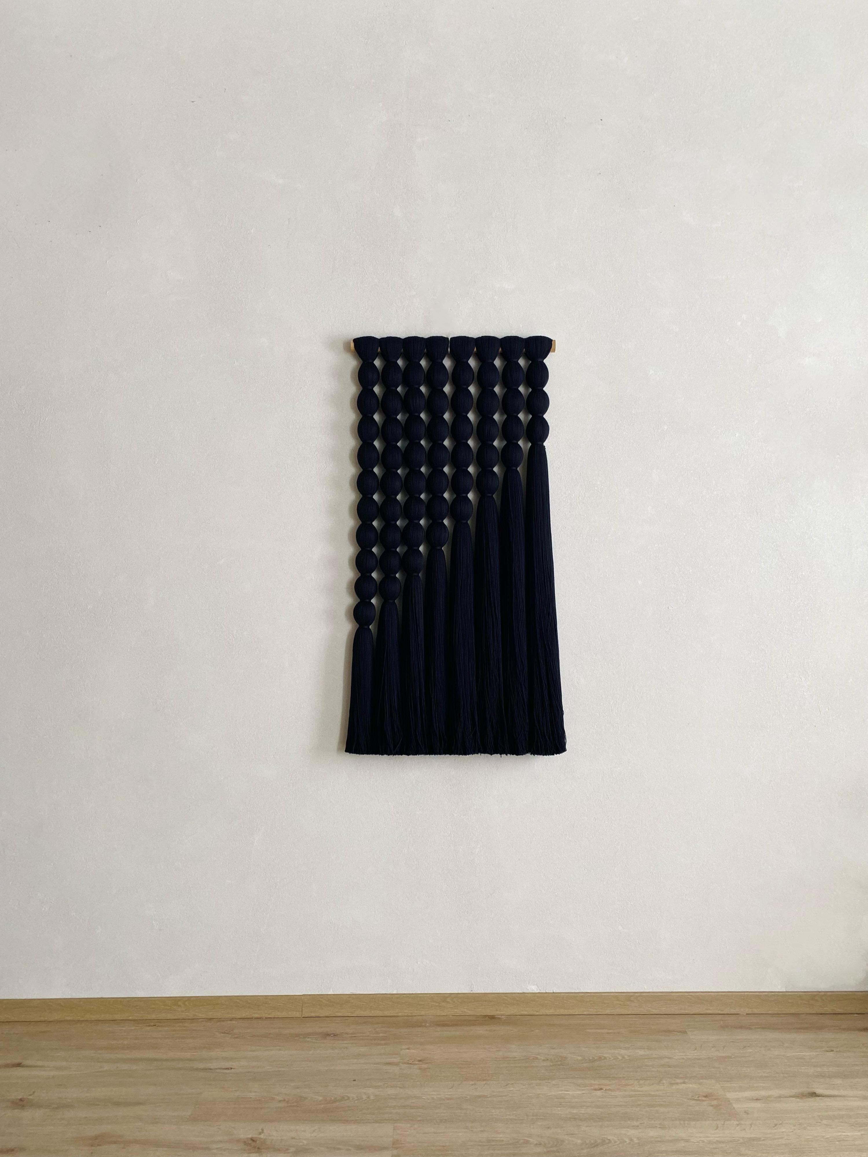This dramatic wall hanging is an impressive statement piece for almost any room.Custom sizes and others colors available by request.
Each piece is completely made to order and is available to ship 8-9 weeks after ordering. 

Handmade by weavers in