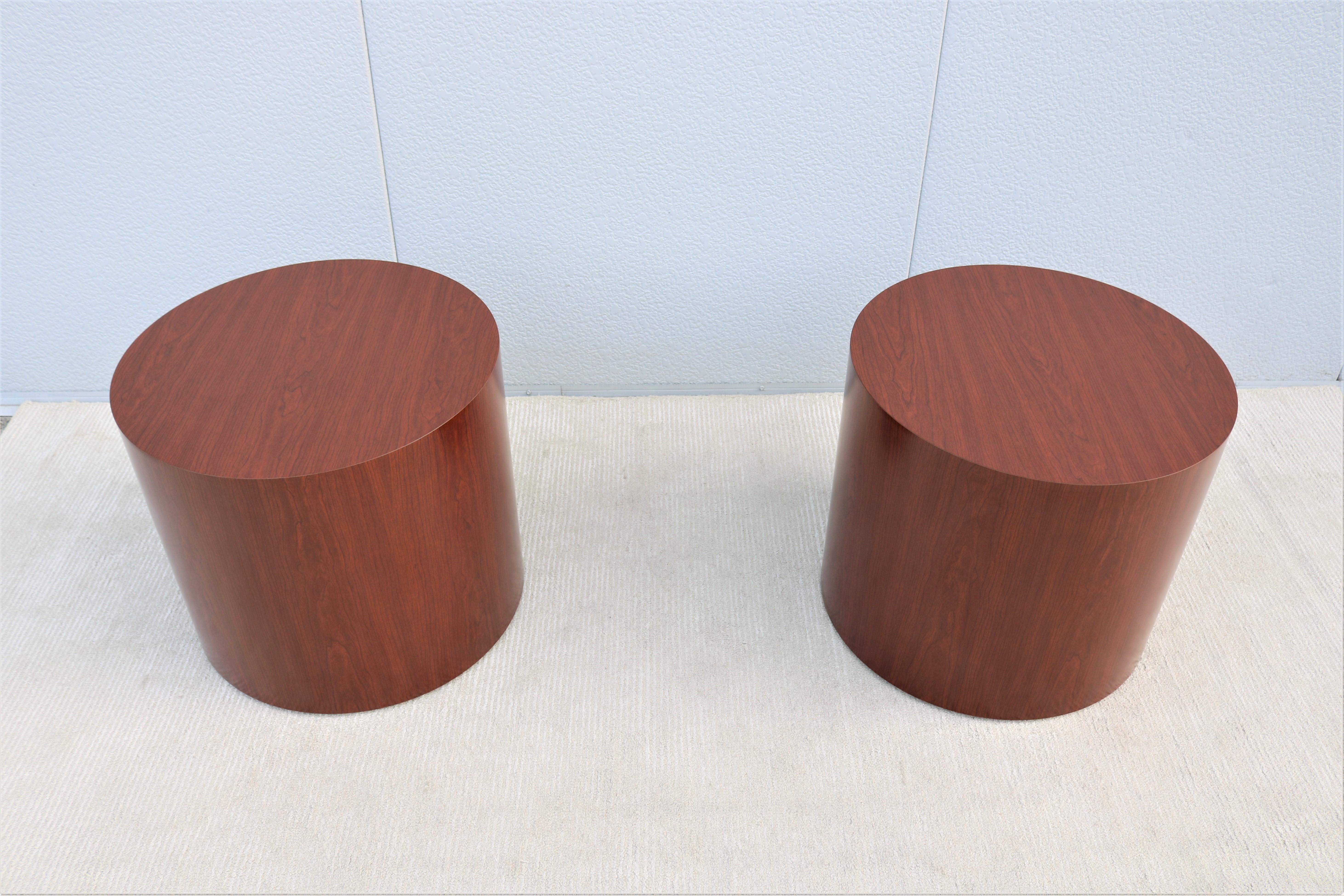 Stunning pair of cherry amber round cylinder drum side or end tables by Kimball and National office furniture. 
Drum tables address a number of functional requirements and fits seamlessly into any environment.
This gorgeous tables combine the