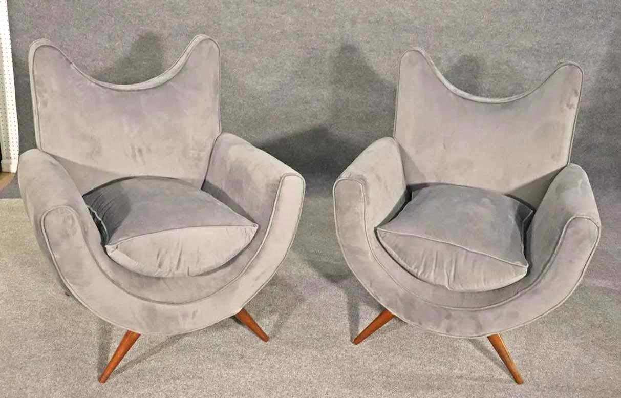 Vintage modern style armchairs with velvet fabric and cone legs. A wild modern design for home or office use.
Please confirm location.