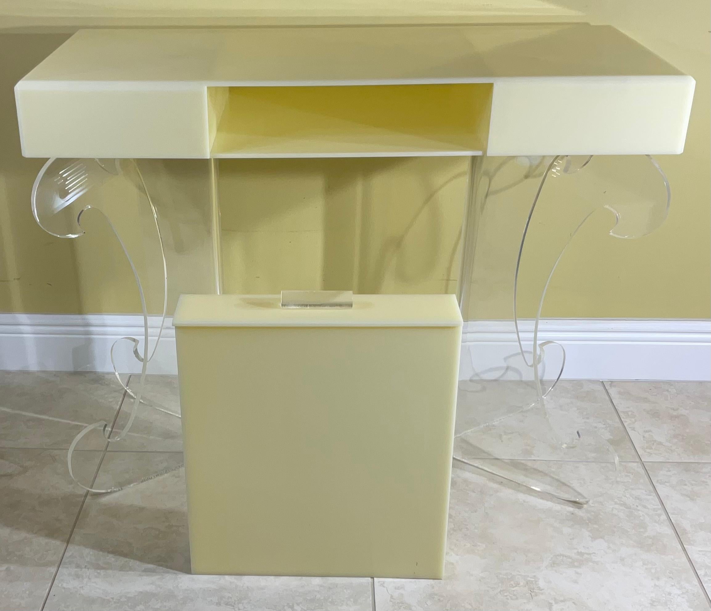 Beautiful Lucite rectangular desk beveled top with butterfly base. One front draw can be used as a desk or decorative console table. In good vintage condition with minimal wear.
     
