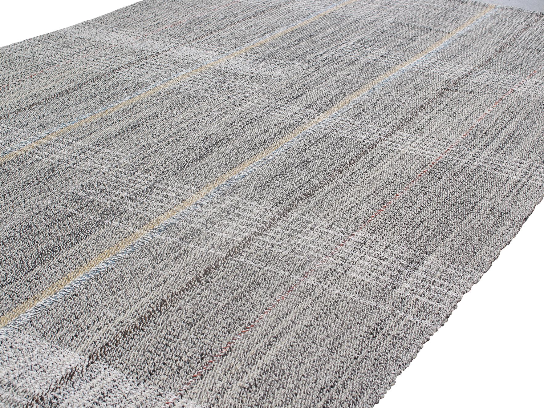 This Pelas flatweave rug is made with handspun wool with a touch of cotton and natural dyes. It is inspired by the Antique kilims that are native to the Kurdish region in Iran. NASIRI continues their rich tradition of rug making by applying the same