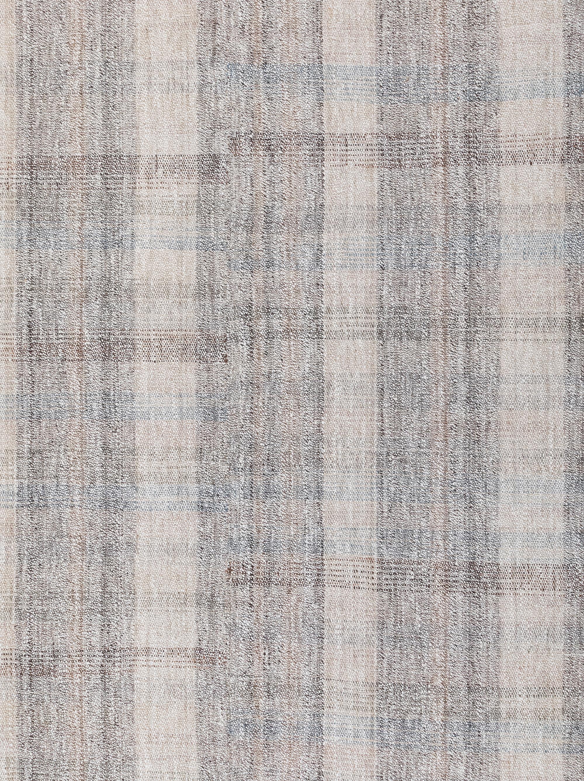 This flatweave rug is made with handspun wool and cotton, and natural dyes.  It is inspired by the antique kilims that are native to the Kurdish region in Iran.  NASIRI continues their rich tradition of rug making by applying the same techniques and