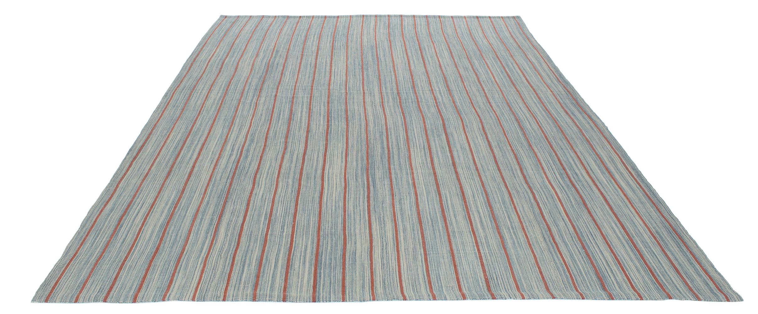 This Pelas flat-weave rug is made with 100% handspun wool and natural dyes. It is inspired by the antique Kilims that are native to the Kurdish region in Iran. Nasiri continues their rich tradition of rug making by applying the same techniques and
