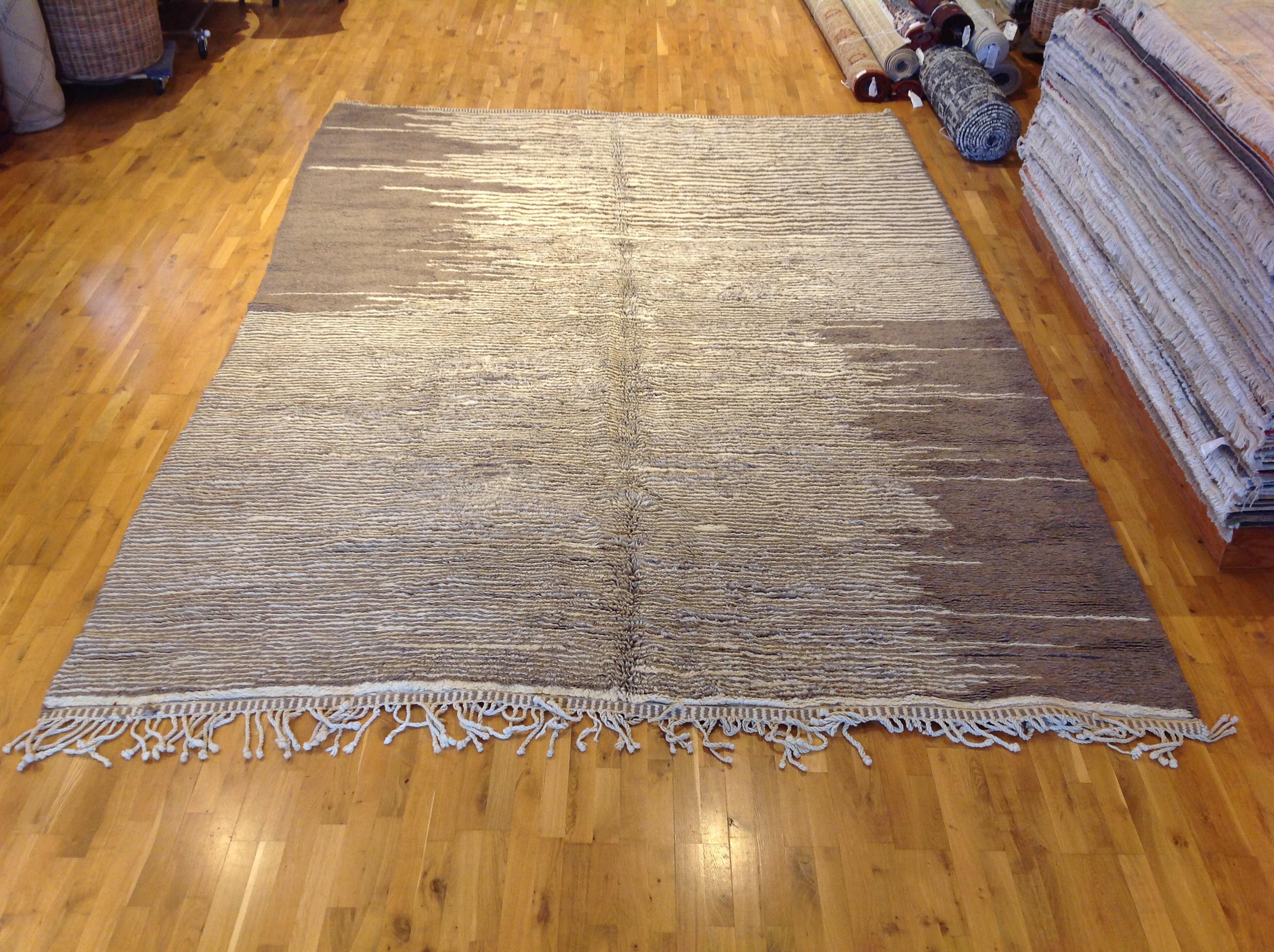 Midcentury inspired look rug to warm up your space. Striated taupy brown across the rug with light ivory accents to give extra depth.