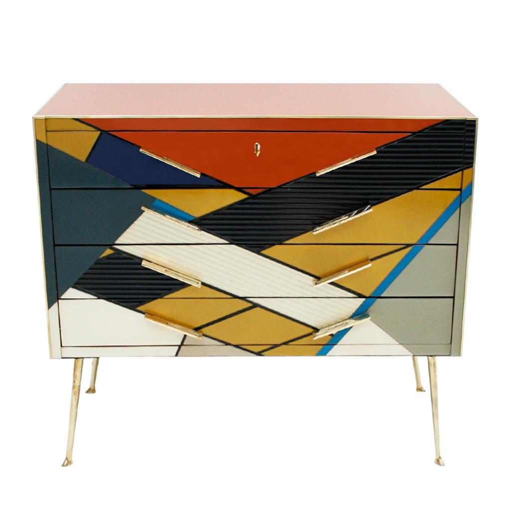 Mid-Century Modern style commode composed of four drawers. Original structure from 1950s made of solid wood and covered with colored Murano glass. Handles and legs made of solid brass. Designed by L.A. Studio and produced in Italy.

Production can