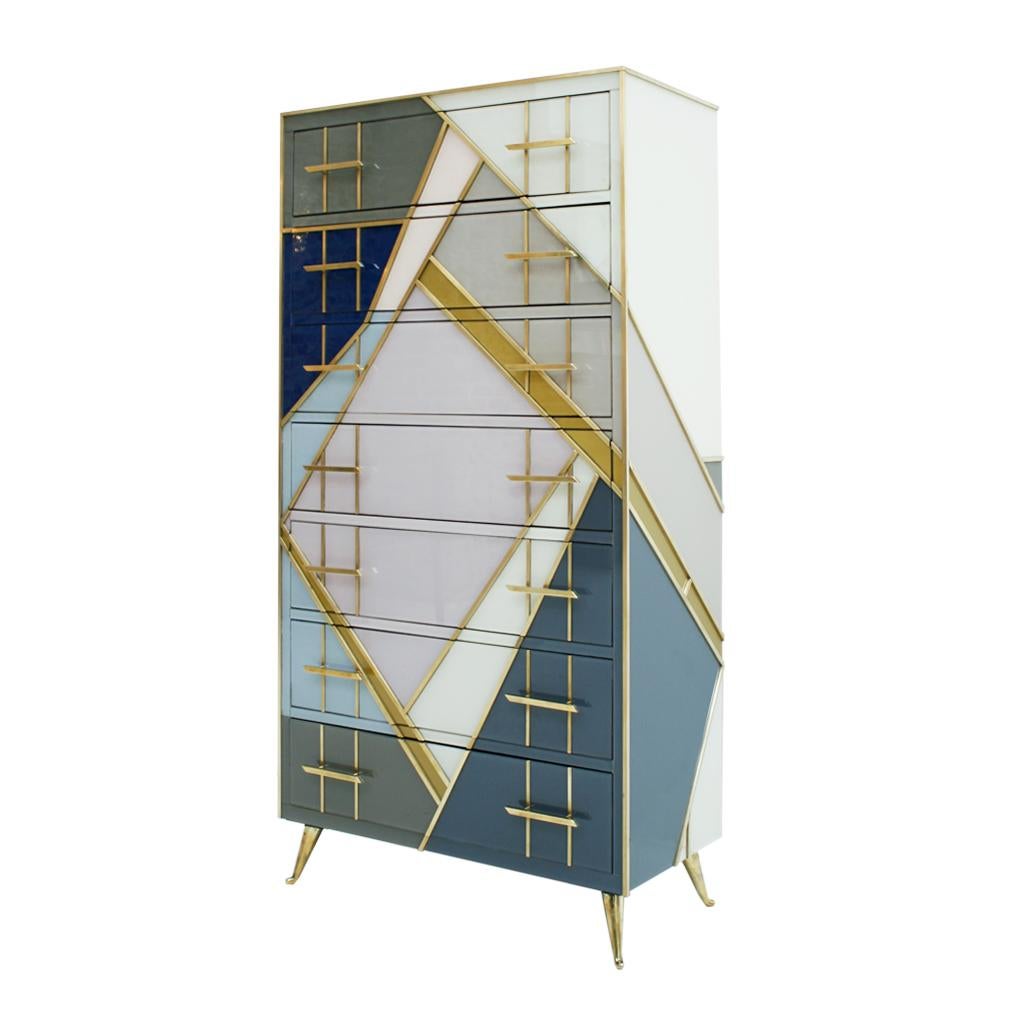 Seven-drawer chest made by hand with original solid wood structure of the 1950s. Coated in colored glass and profiles, handles and brass legs.

Every item LA Studio offers is checked by our team of 10 craftsmen in our in-house workshop. Special