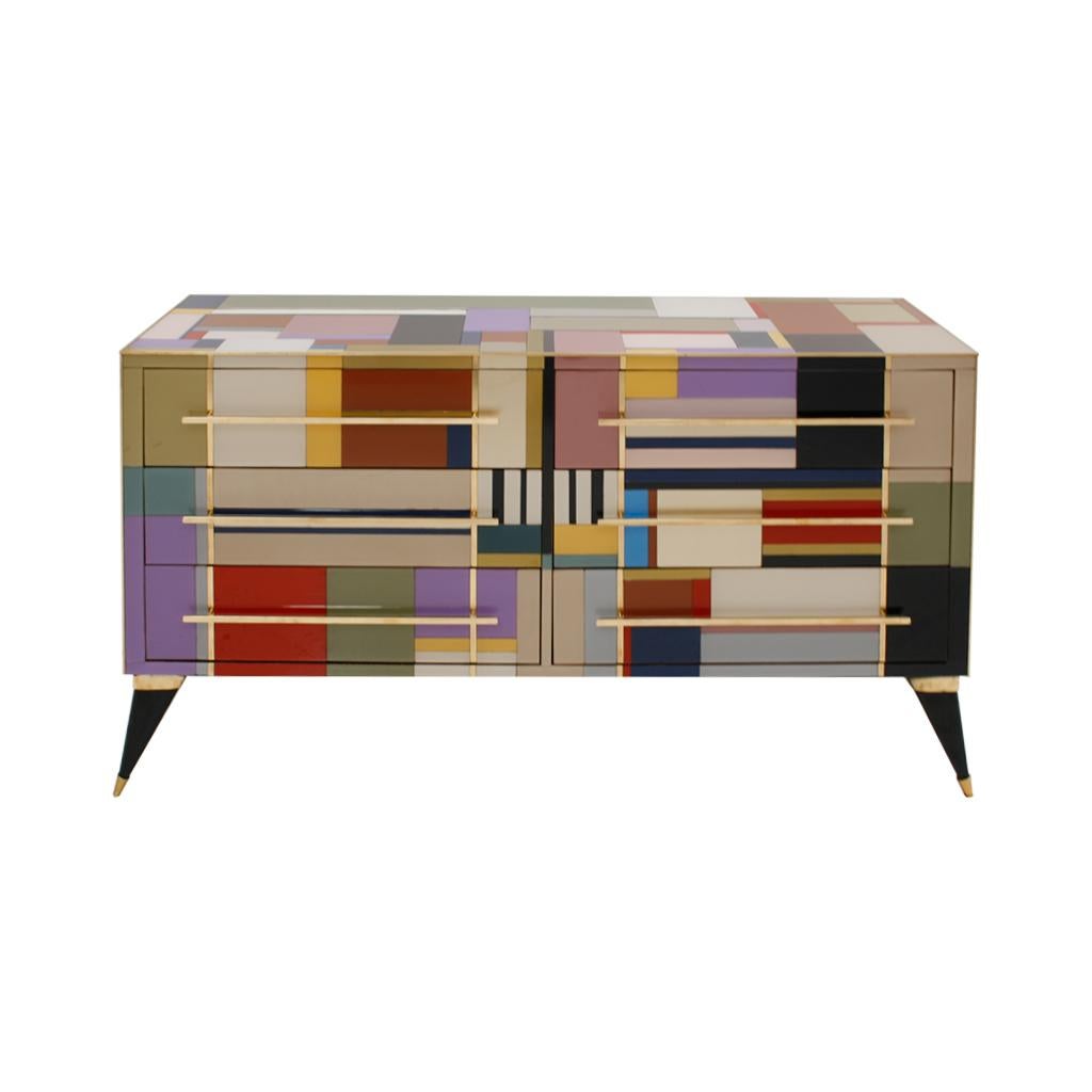 Italian sideboard designed by L.A. Studio. Made of solid wood structure from 50S, covered in colored glass. Brass profiles and handles. Composed of six drawers. Made in Italy.

Production time between 5 and 6 weeks.

Take into account that the